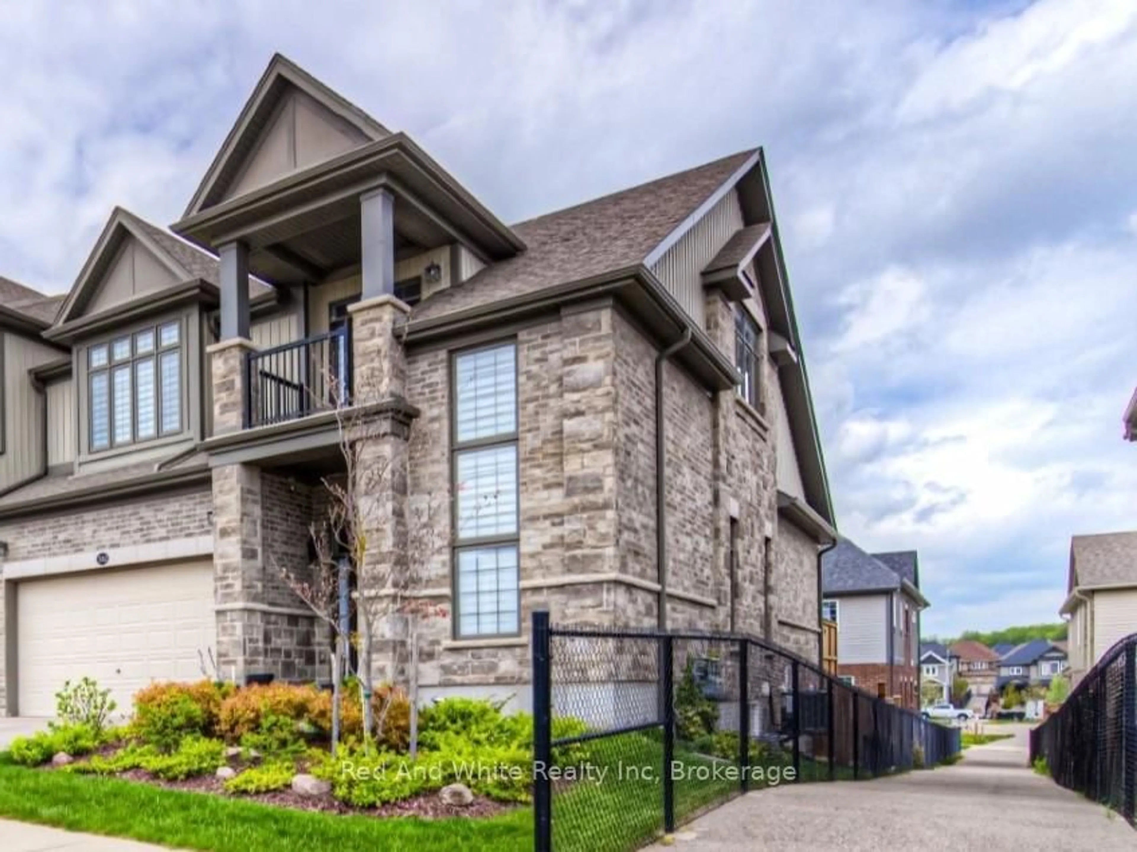 Home with brick exterior material, street for 582 Mayapple St, Waterloo Ontario N2V 0E3