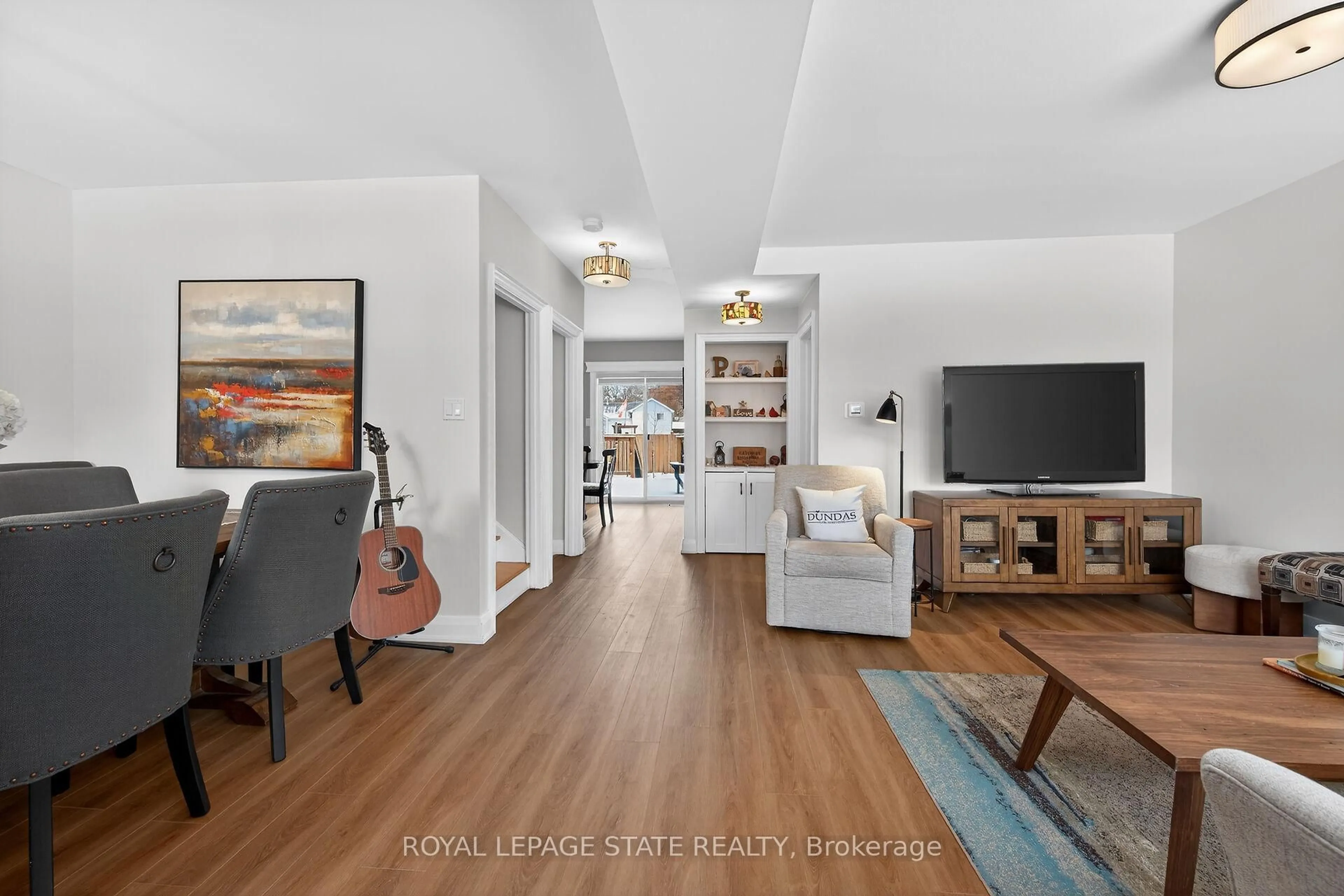 Living room with furniture, wood/laminate floor for 13 Cameron Ave, Hamilton Ontario L9H 1P4