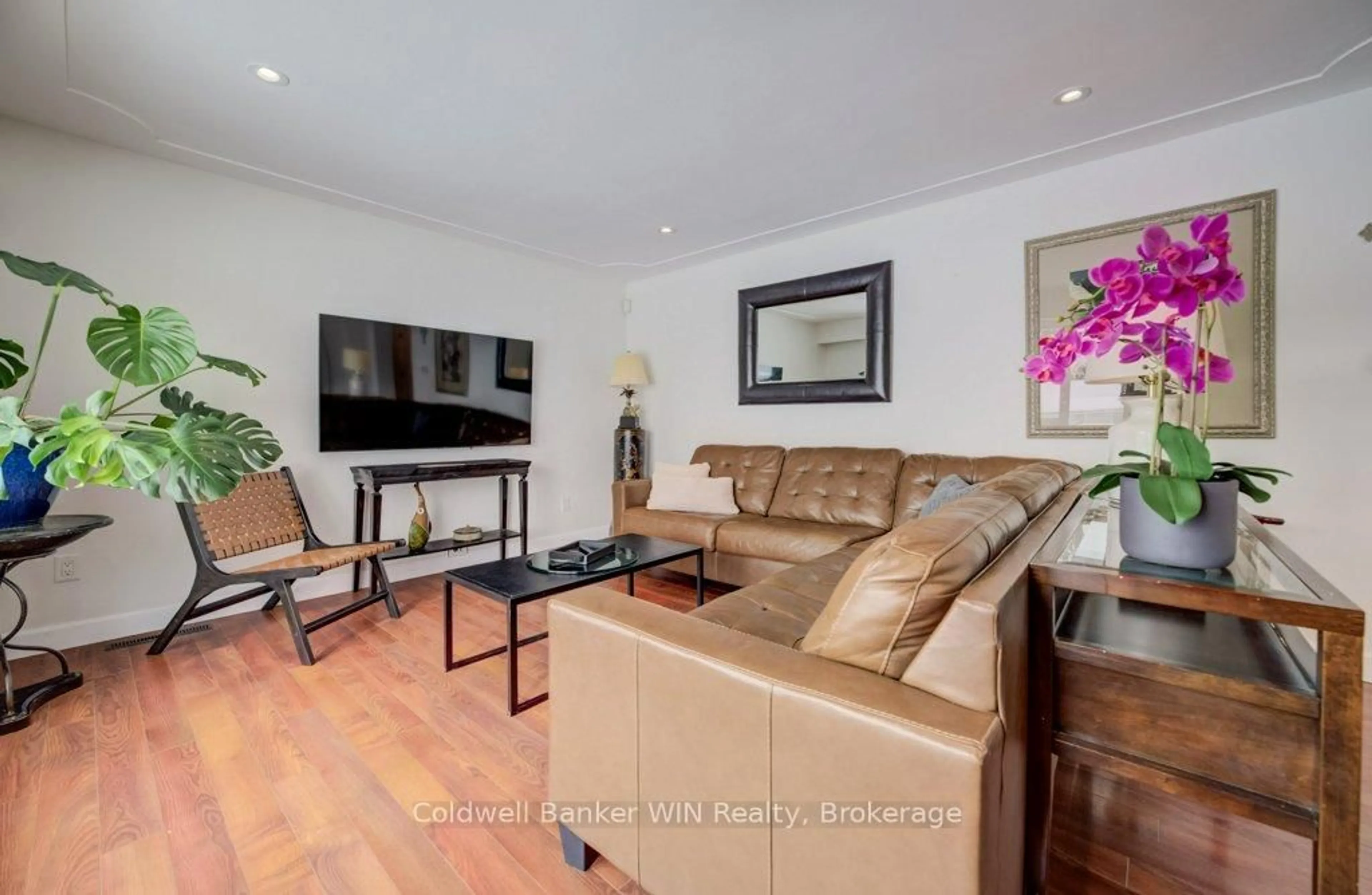 Living room with furniture, wood/laminate floor for 185 Miller St, Wellington North Ontario N0G 2L3