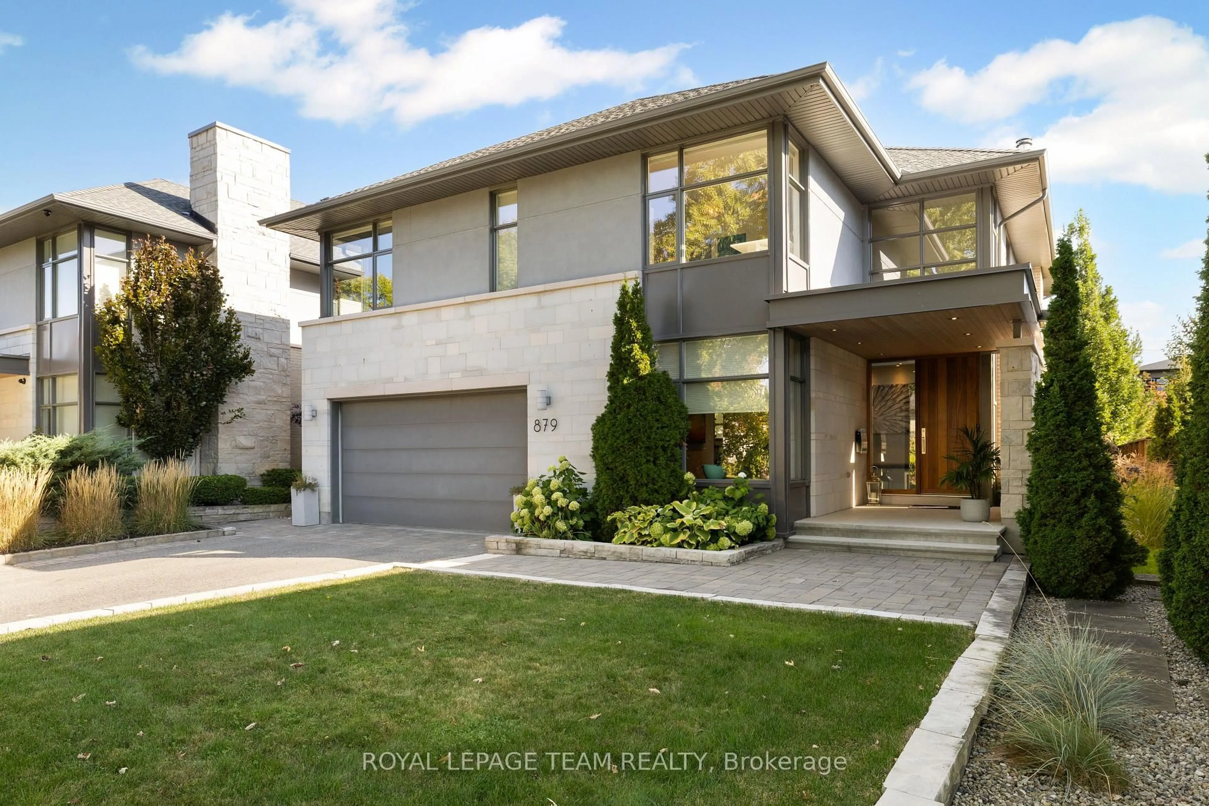 Home with brick exterior material, street for 879 Winnington Ave, Ottawa Ontario K2B 5C4