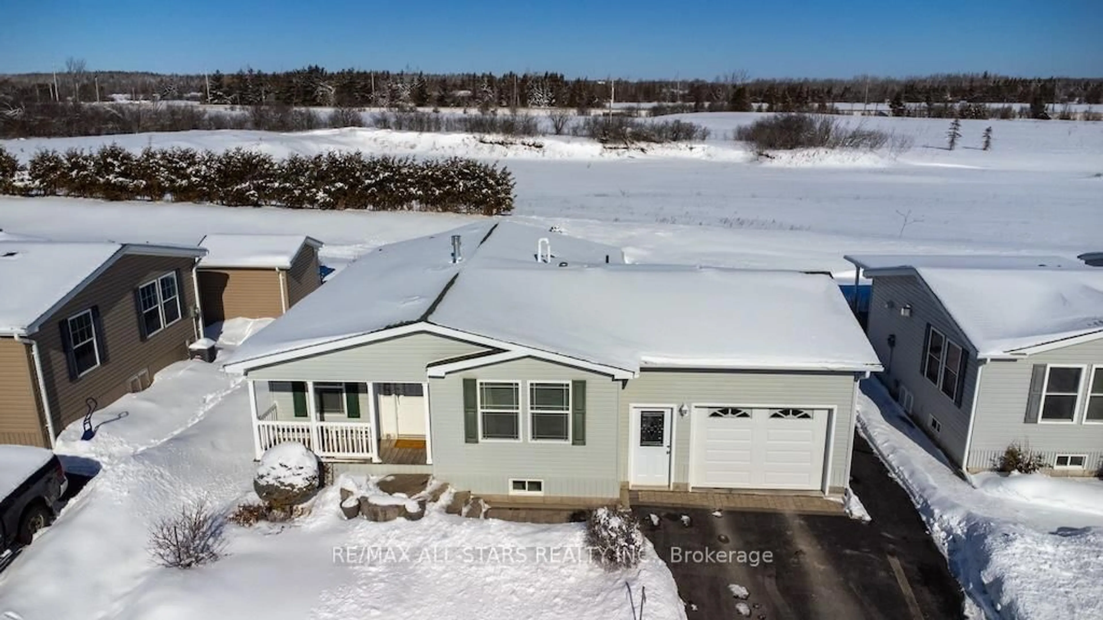 A pic from outside/outdoor area/front of a property/back of a property/a pic from drone, unknown for 37 Creekside Circ, Kawartha Lakes Ontario K0M 1L0