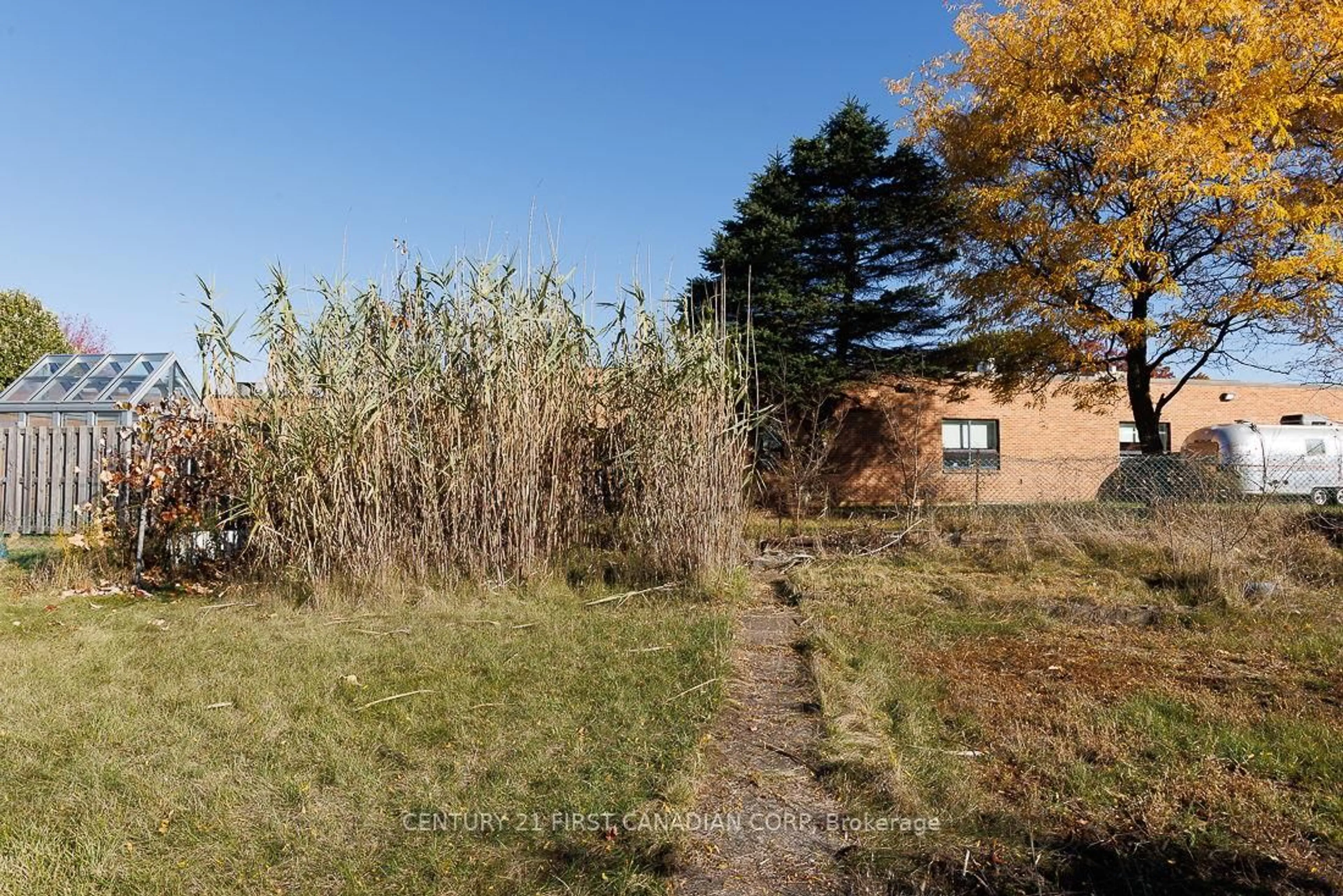 A pic from outside/outdoor area/front of a property/back of a property/a pic from drone, forest/trees view for 1230 Hamilton Rd, London East Ontario N5W 1B2