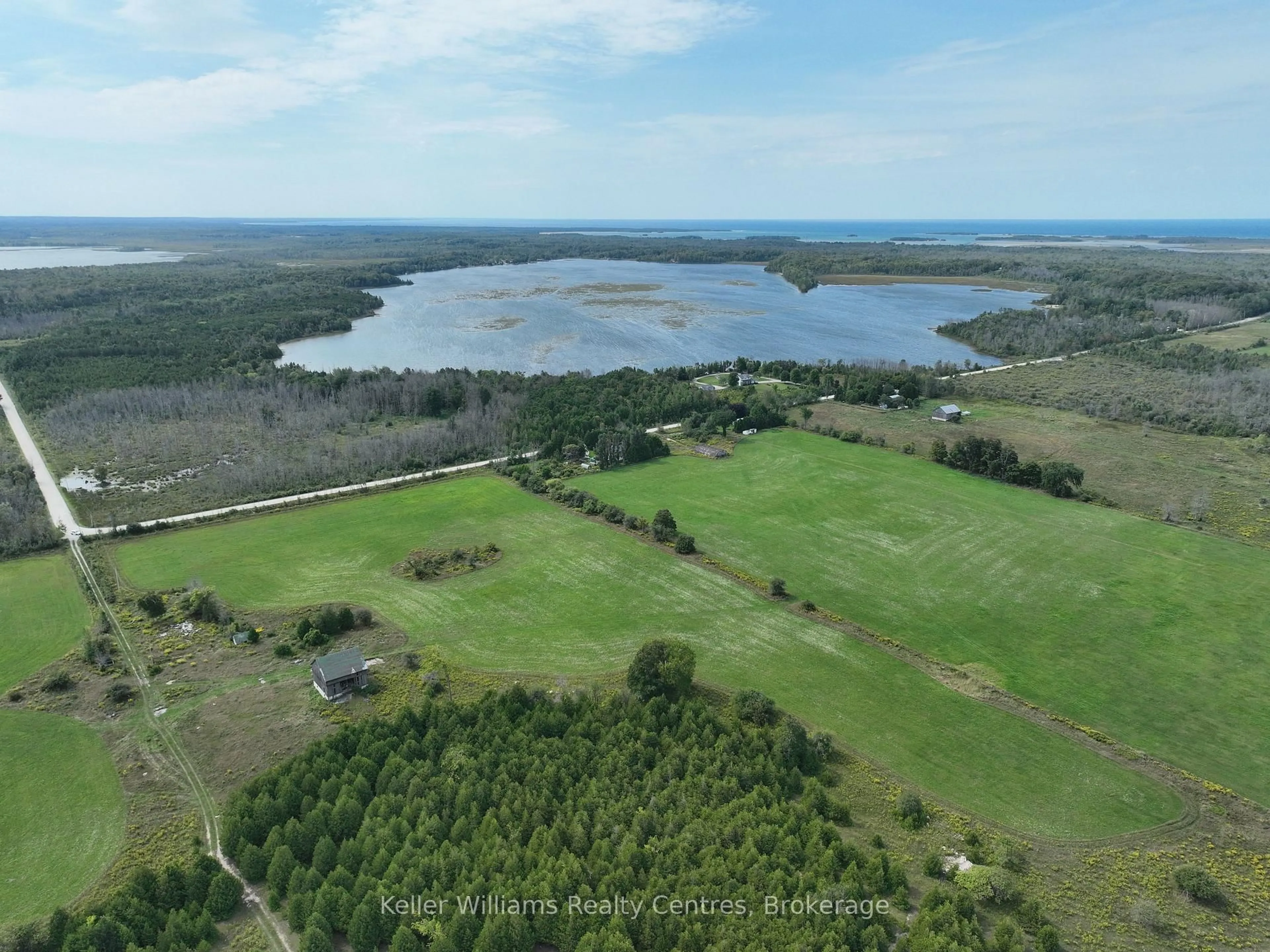 A pic from outside/outdoor area/front of a property/back of a property/a pic from drone, water/lake/river/ocean view for 387 SPRY LAKE Rd, South Bruce Peninsula Ontario N0H 2T0