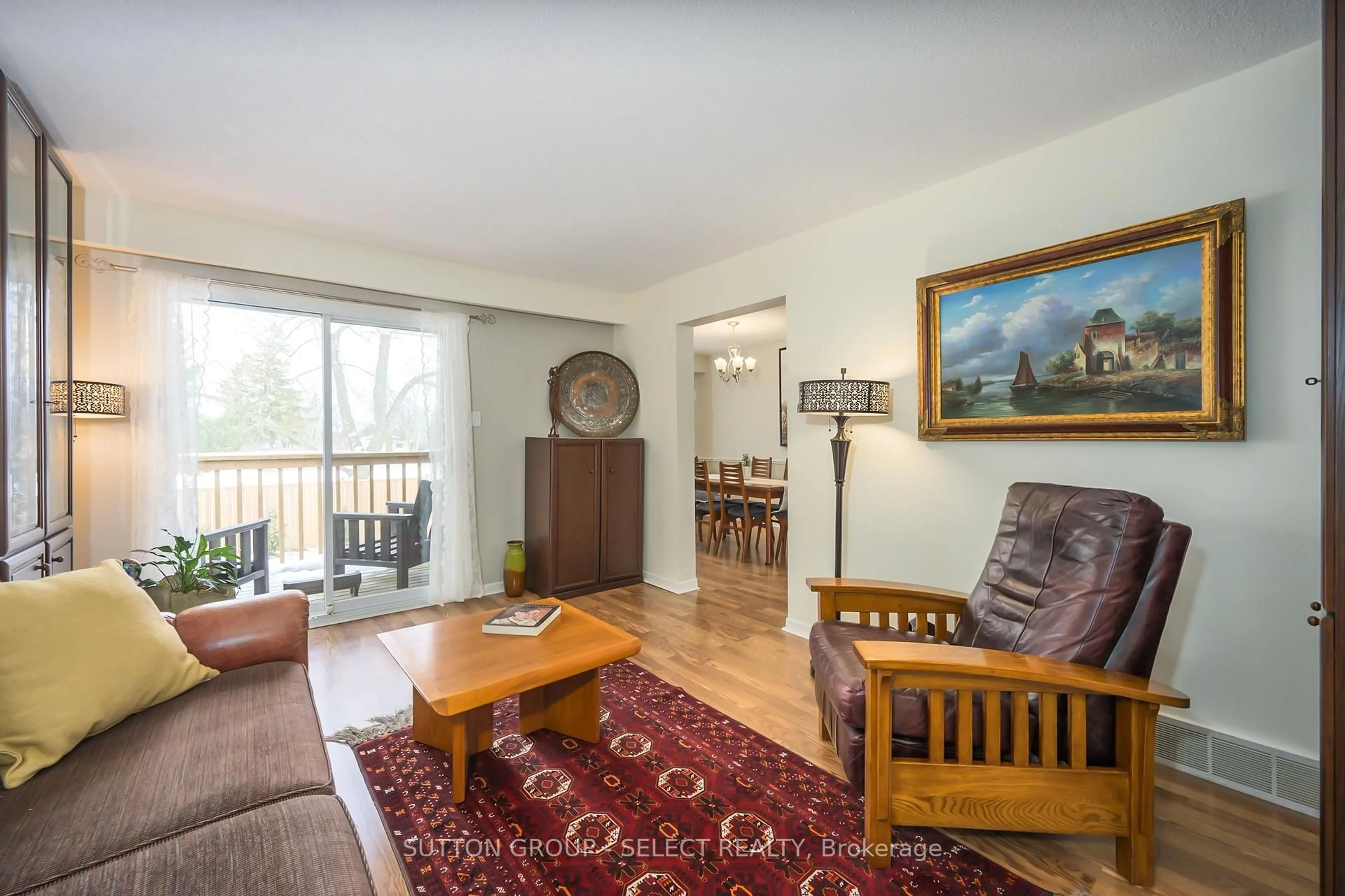 Living room with furniture, wood/laminate floor for 900 Pond View Rd #40, London South Ontario N5Z 4L7