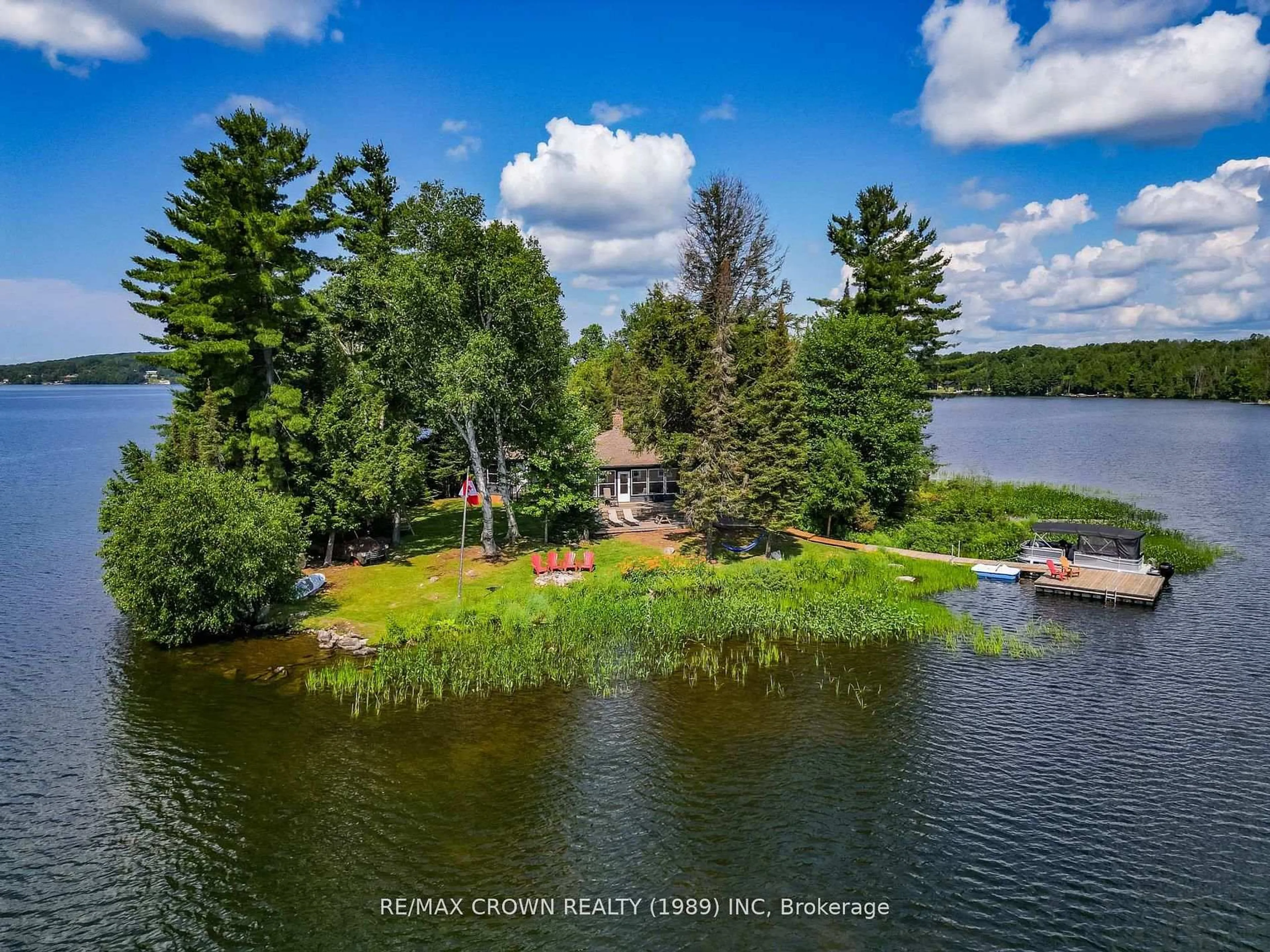 A pic from outside/outdoor area/front of a property/back of a property/a pic from drone, water/lake/river/ocean view for 71 Northwoods Drive Island, East Ferris Ontario P0H 1K0