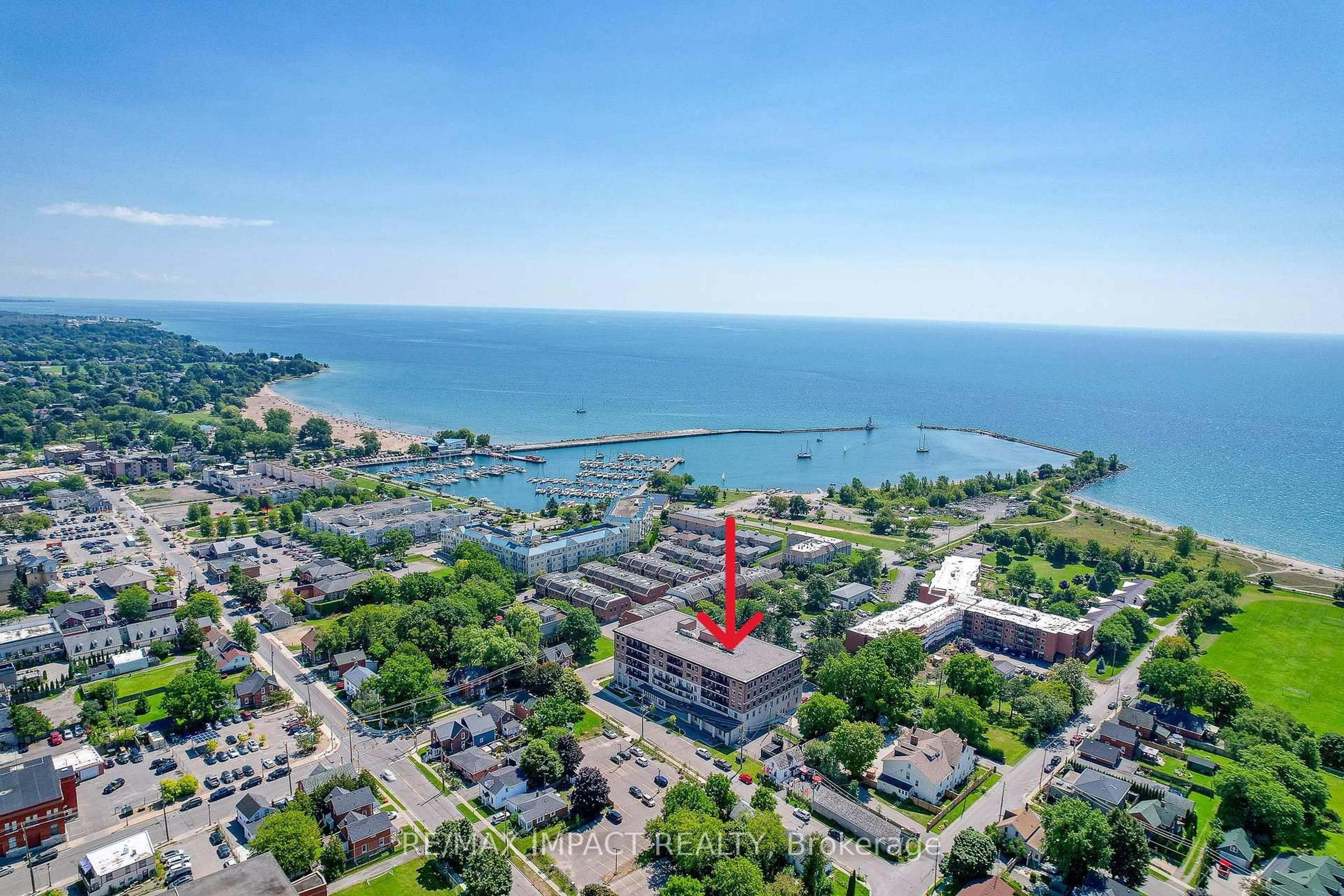 A pic from outside/outdoor area/front of a property/back of a property/a pic from drone, water/lake/river/ocean view for 135 Orr St #212, Cobourg Ontario K9A 0J6