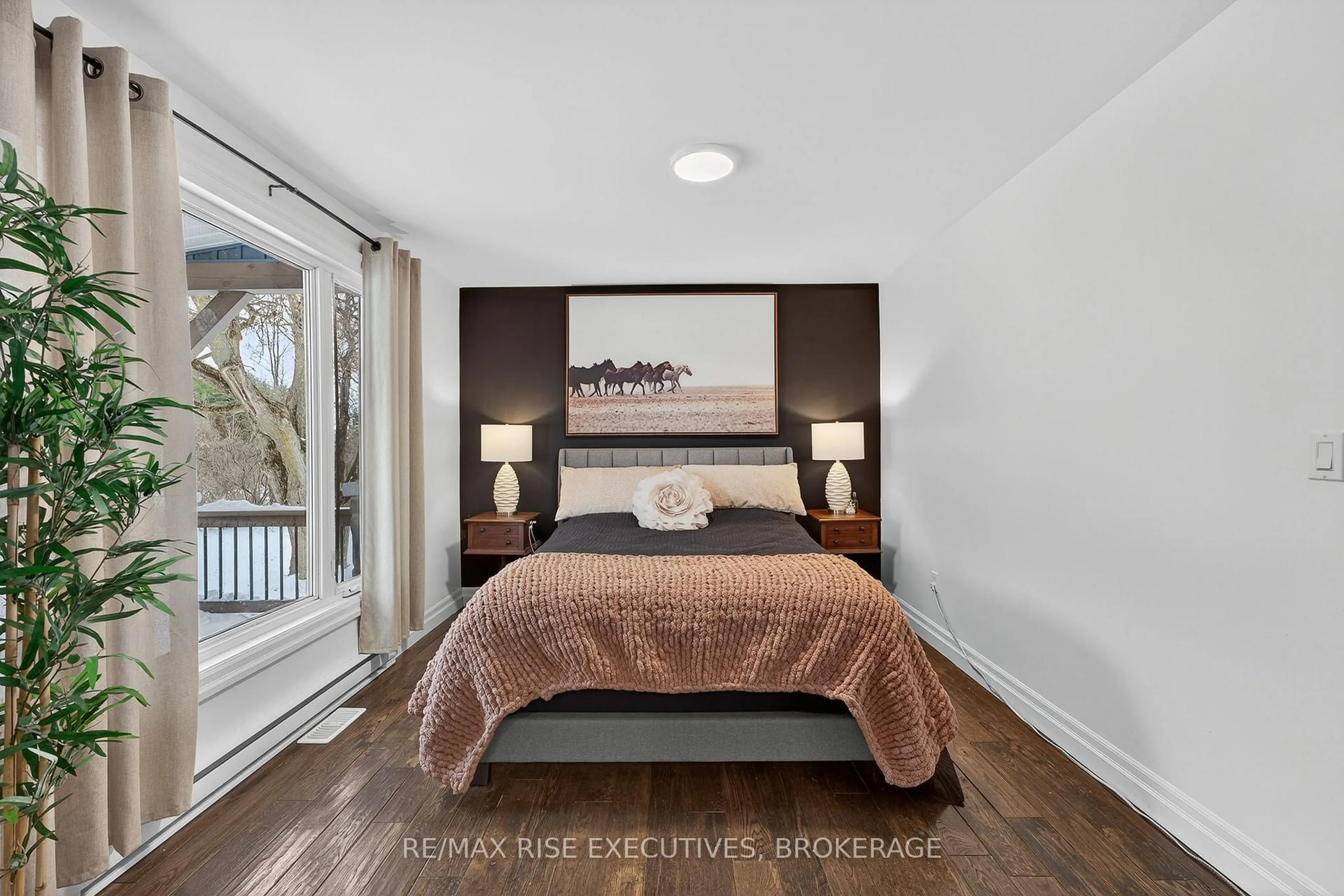 Bedroom with bed, wood/laminate floor for 6213 County Road 2, Bissett Creek Ontario K0H 2H0