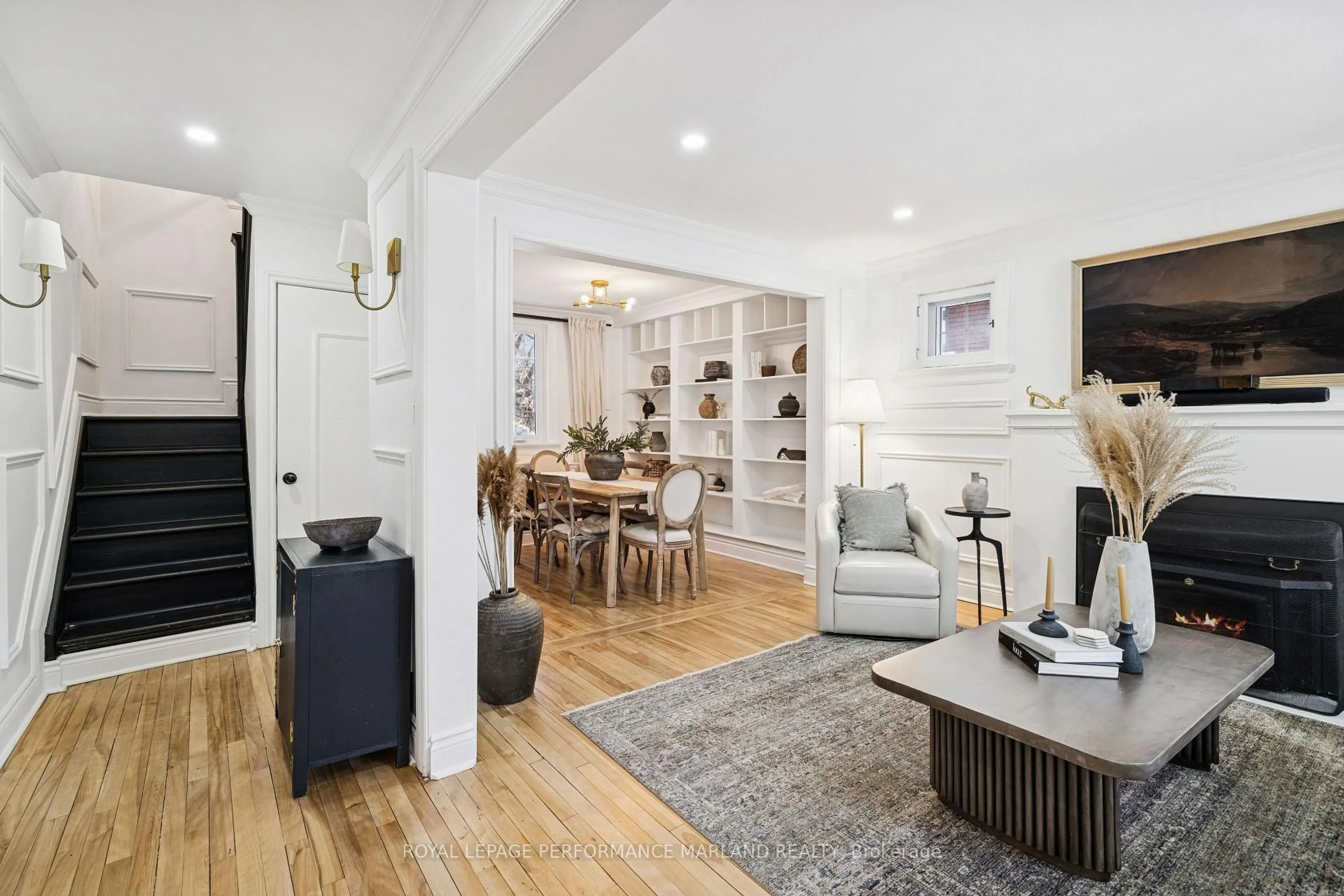 Living room with furniture, wood/laminate floor for 186 Aylmer Ave, Ottawa Ontario K1S 2Y6