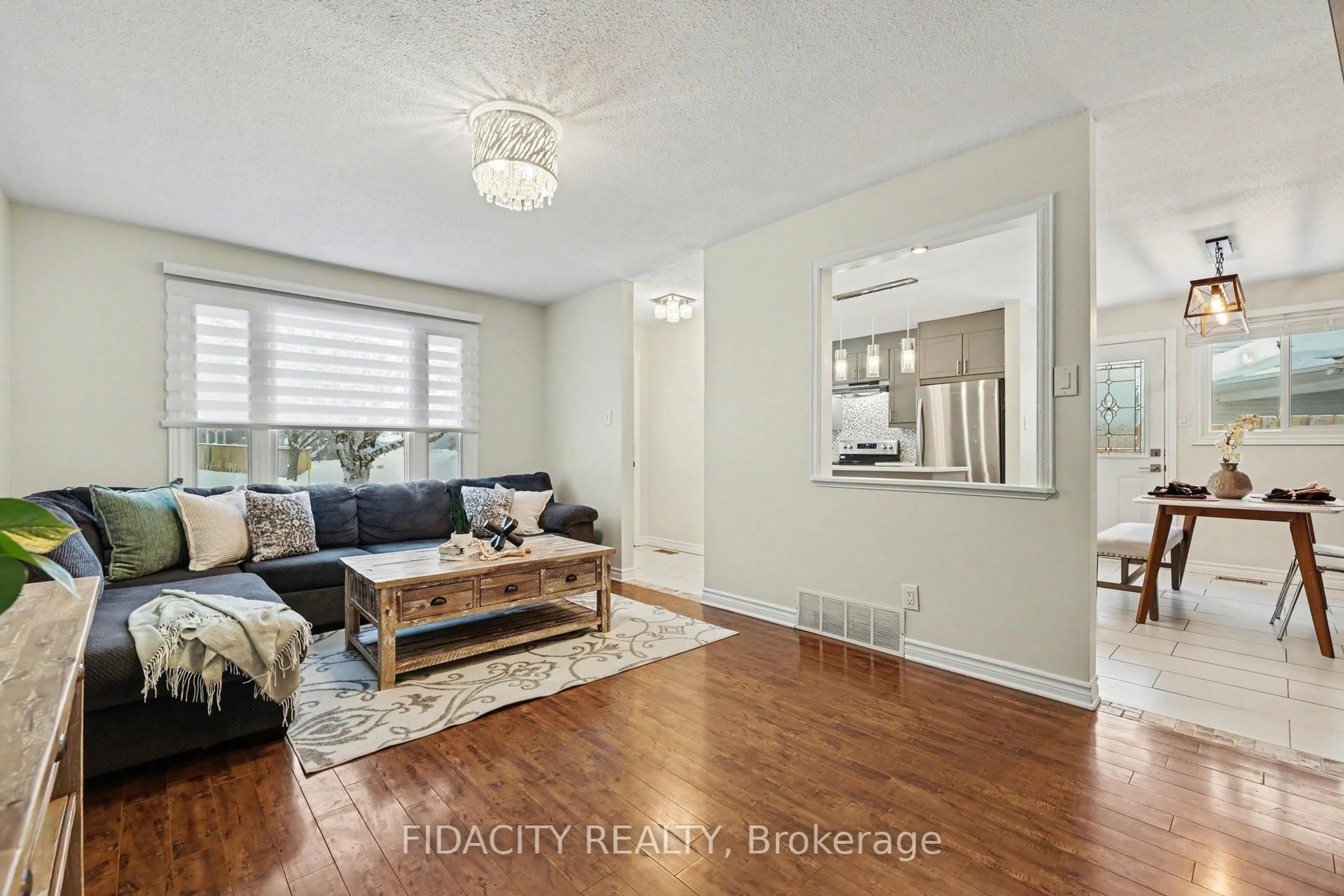 Living room with furniture, wood/laminate floor for 53 Morton Dr, Ottawa Ontario K2L 1W9
