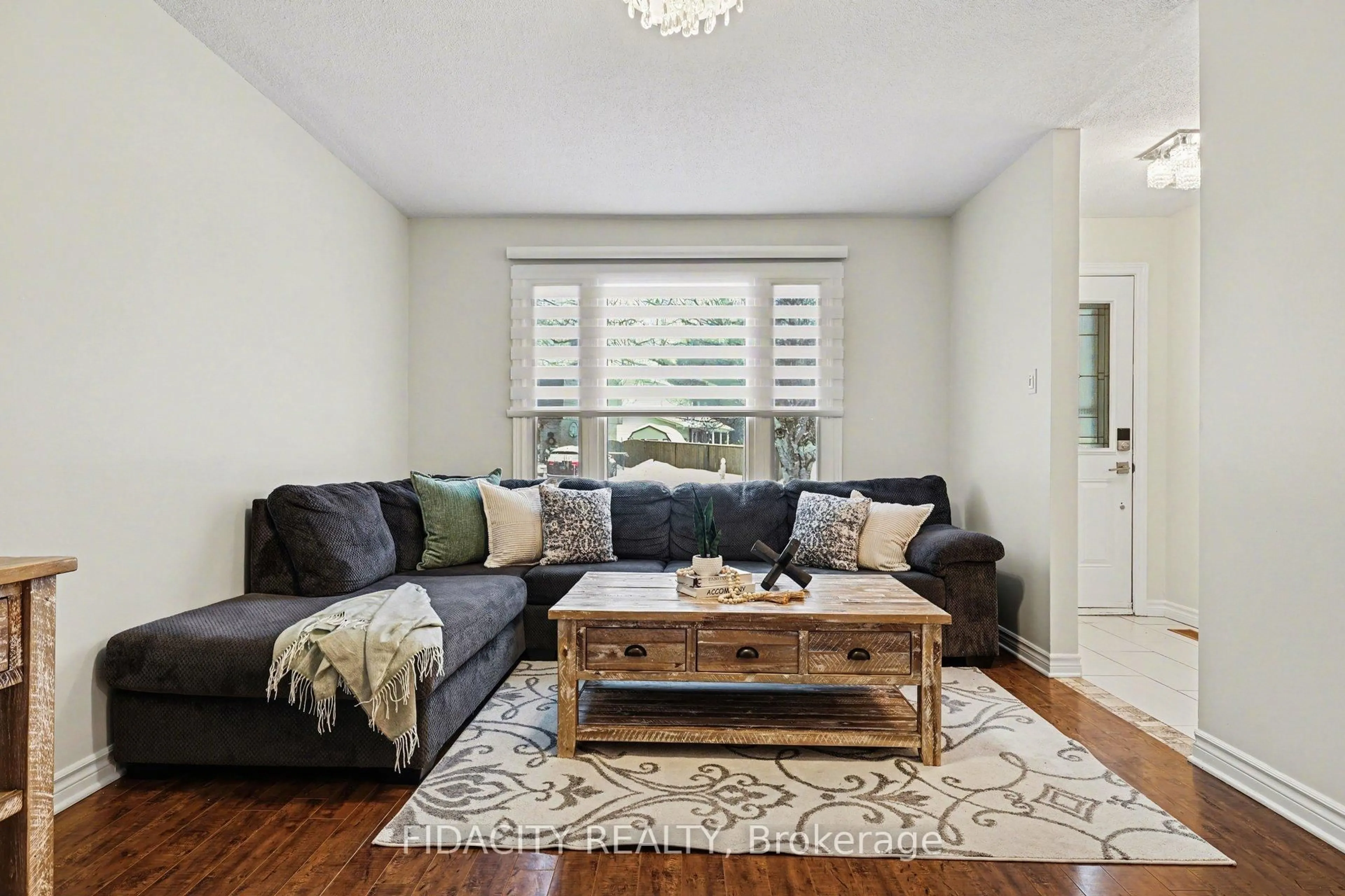 Living room with furniture, wood/laminate floor for 53 Morton Dr, Ottawa Ontario K2L 1W9