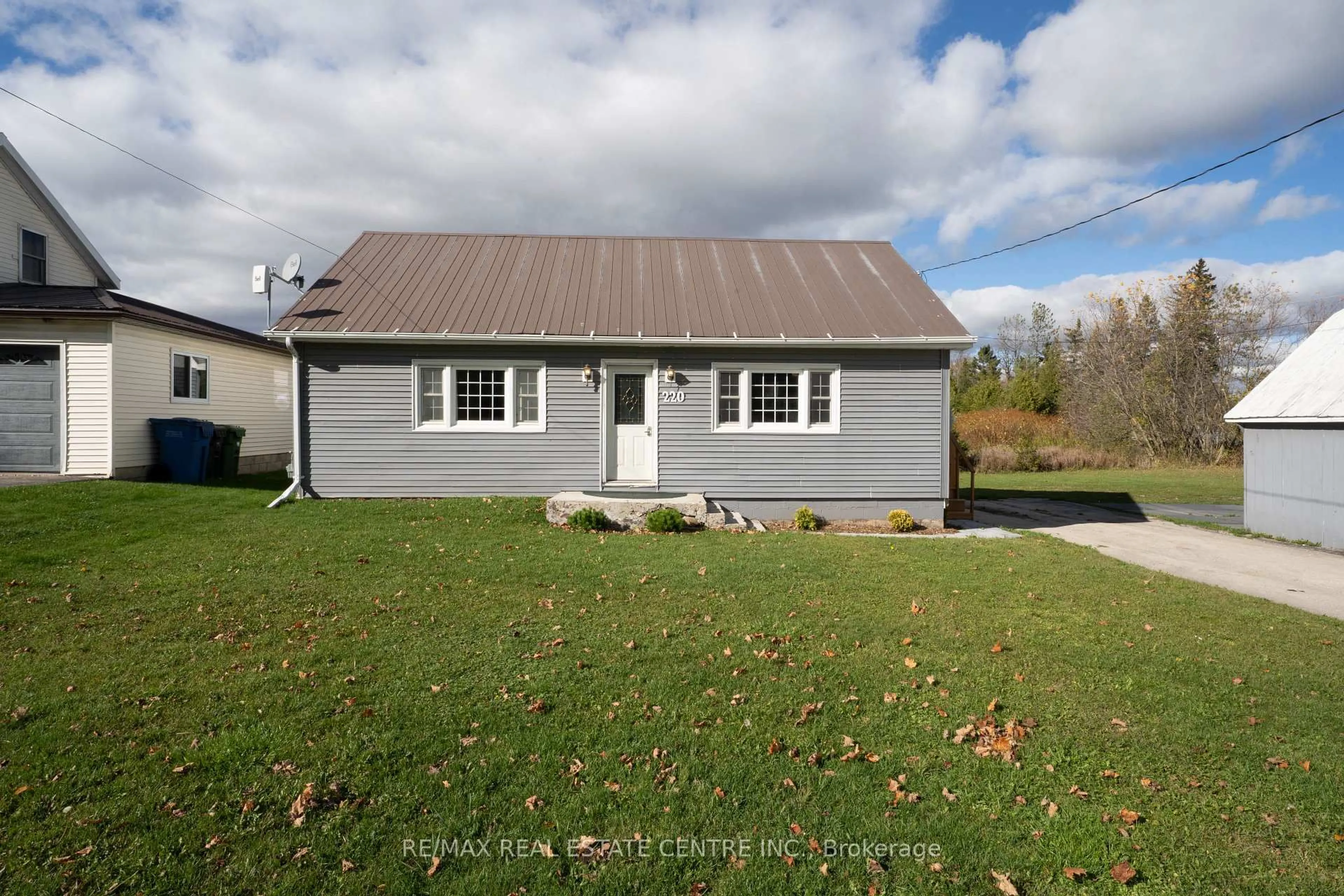 Home with vinyl exterior material, street for 220 Owen Sound St, Southgate Ontario N0C 1C0