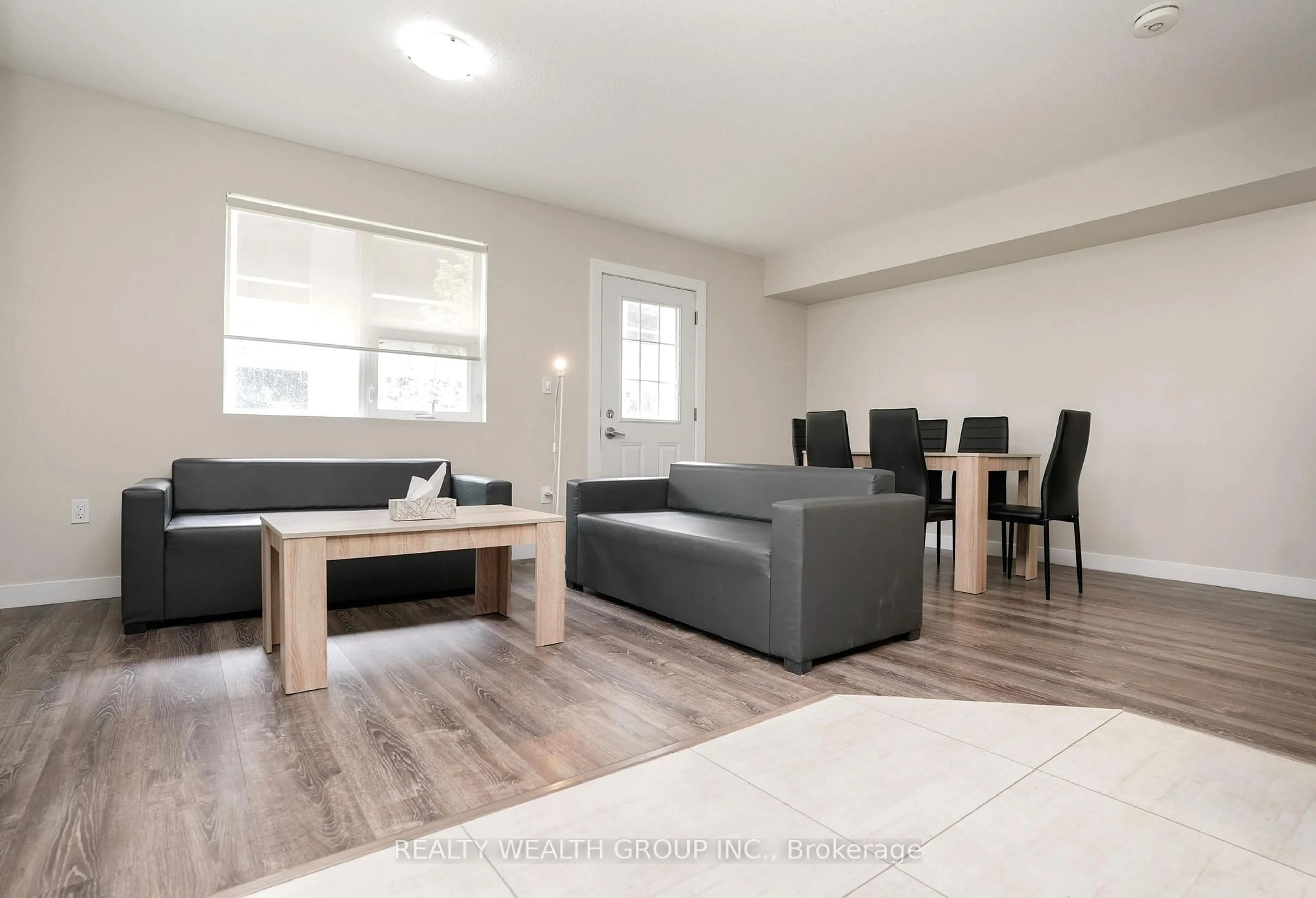 Living room with furniture, wood/laminate floor for 288 Albert St #113, Waterloo Ontario N2L 0G9