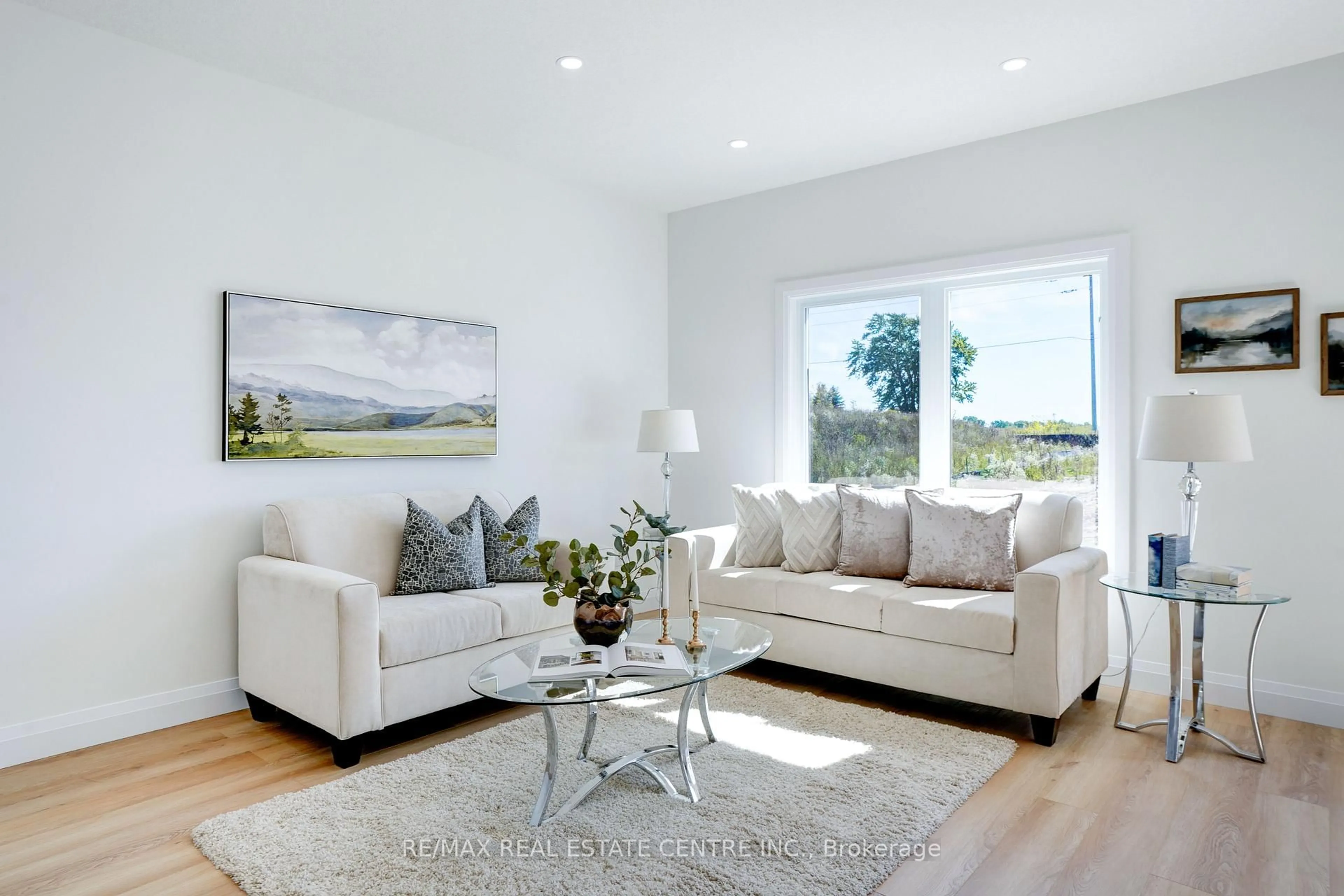 Living room with furniture, wood/laminate floor for 2524 Constance Ave, London South Ontario N6M 1E7