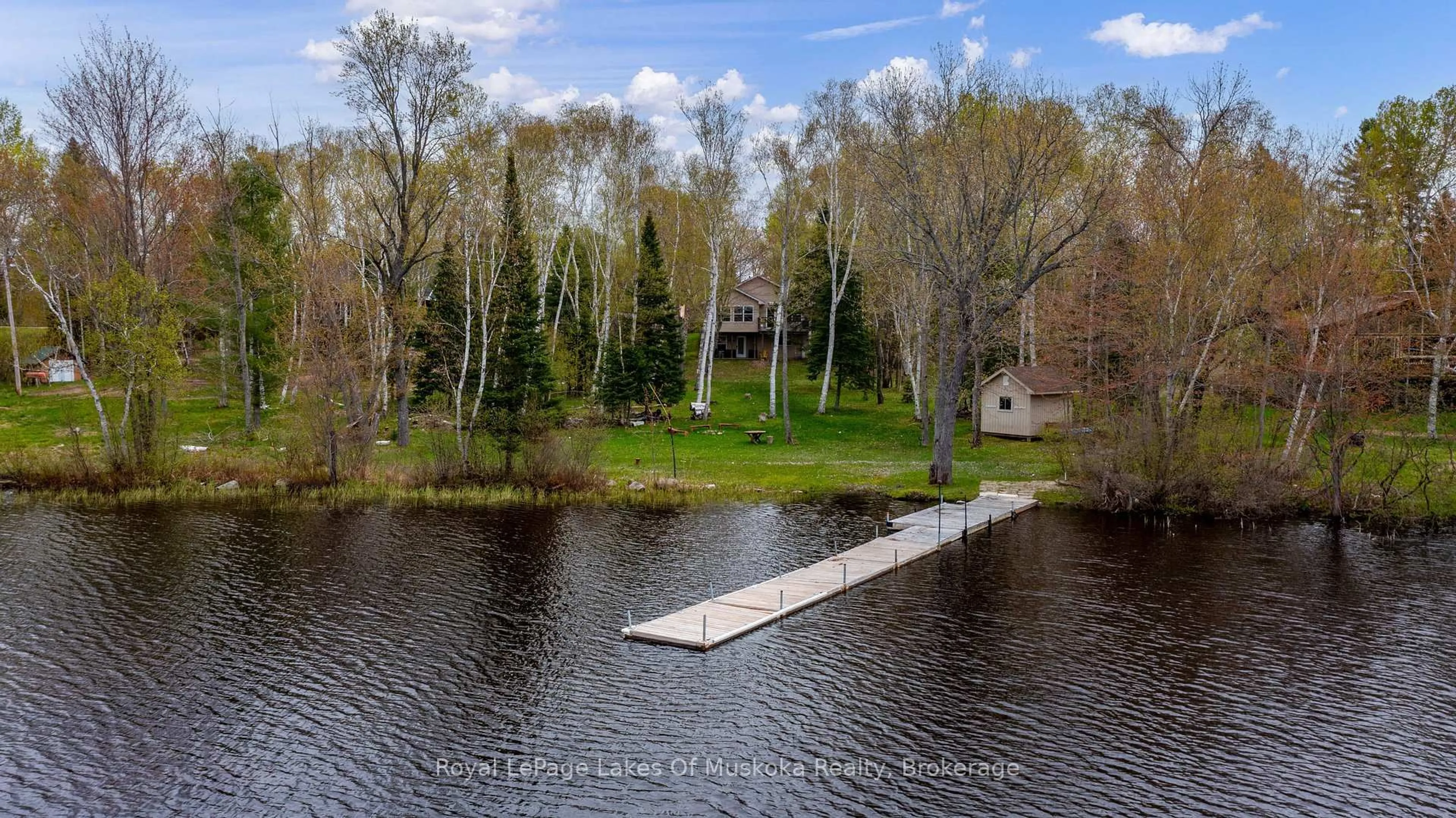 A pic from outside/outdoor area/front of a property/back of a property/a pic from drone, water/lake/river/ocean view for 1136 LAKESIDE Tr, Magnetawan Ontario P0A 1P0