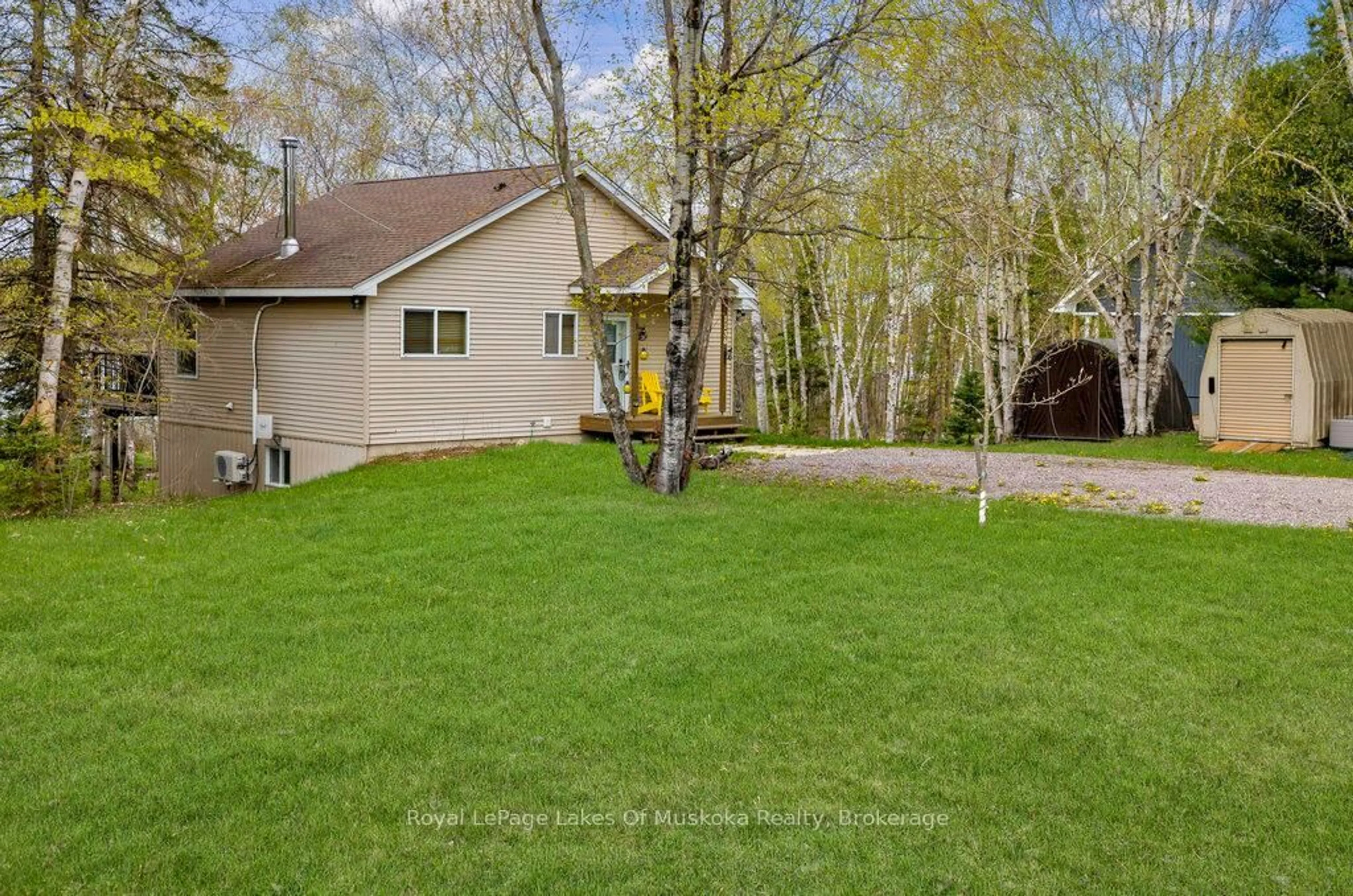 A pic from outside/outdoor area/front of a property/back of a property/a pic from drone, forest/trees view for 1136 LAKESIDE Tr, Magnetawan Ontario P0A 1P0
