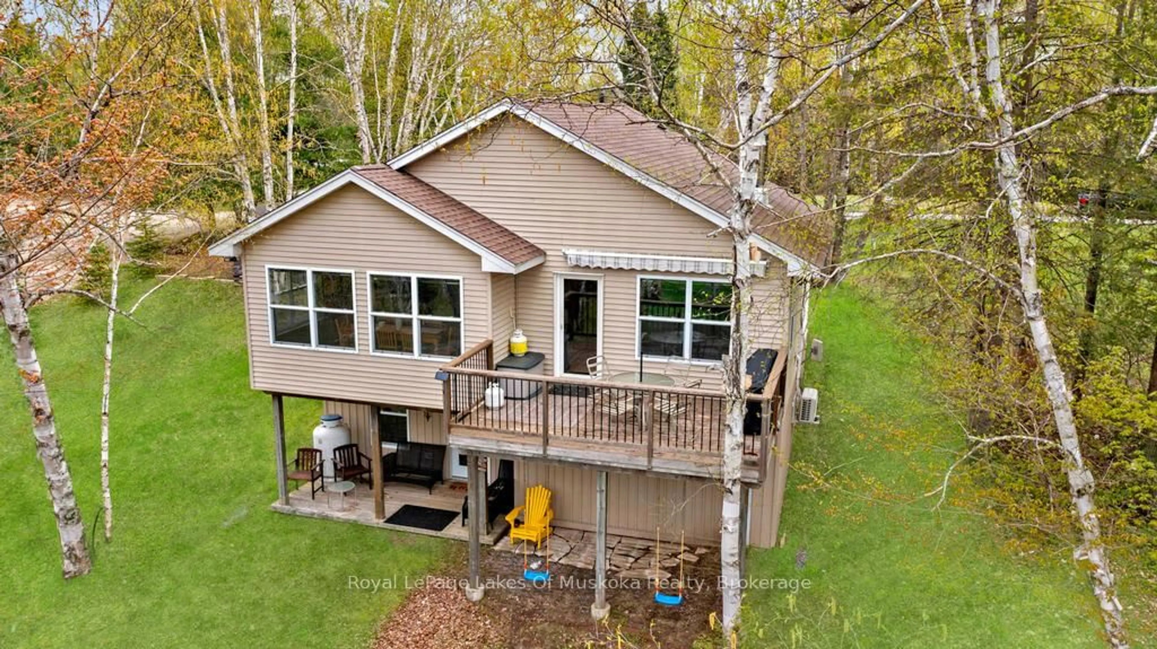 A pic from outside/outdoor area/front of a property/back of a property/a pic from drone, water/lake/river/ocean view for 1136 LAKESIDE Tr, Magnetawan Ontario P0A 1P0