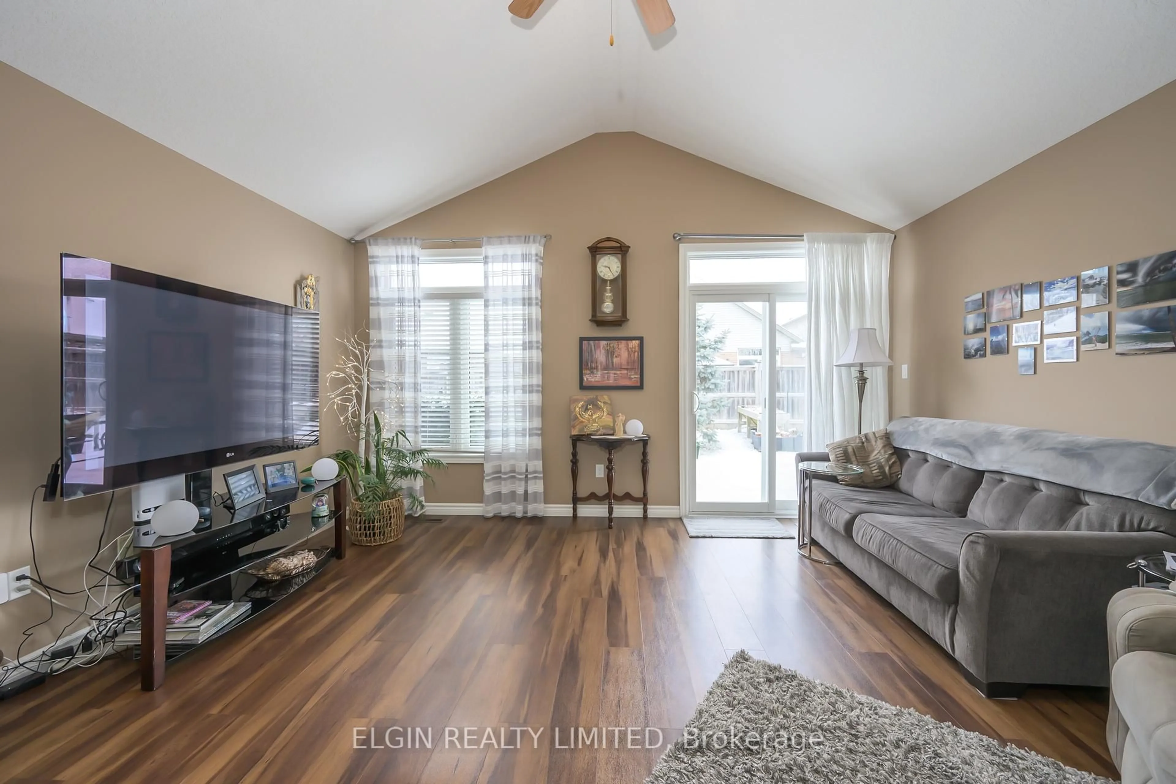 Living room with furniture, wood/laminate floor for 18 Cardinal Crt, St. Thomas Ontario N5P 0C5