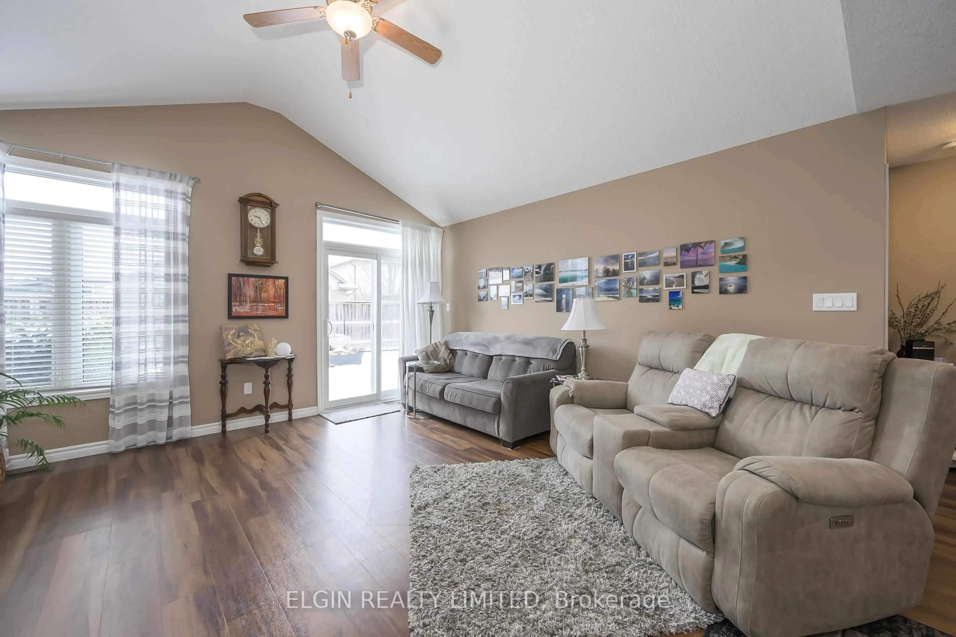 Living room with furniture, wood/laminate floor for 18 Cardinal Crt, St. Thomas Ontario N5P 0C5