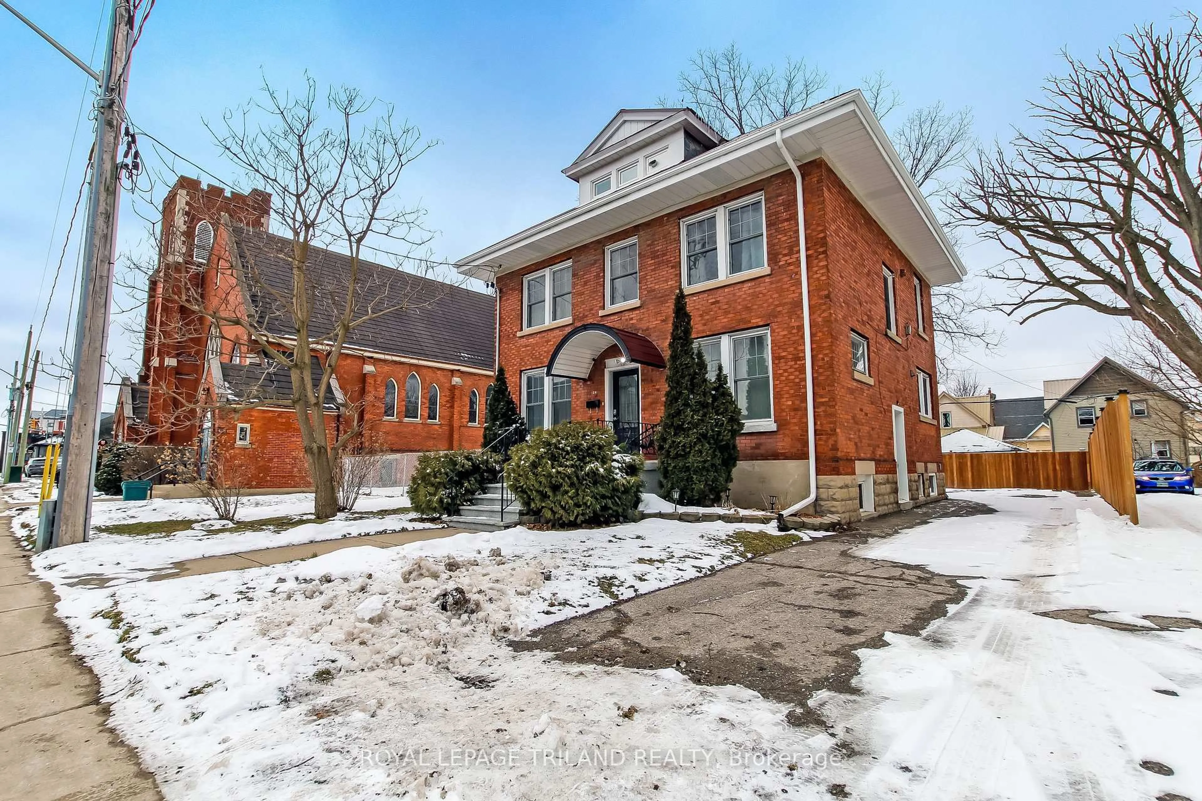 Home with brick exterior material, street for 24 Flora St, St. Thomas Ontario N5P 2X4