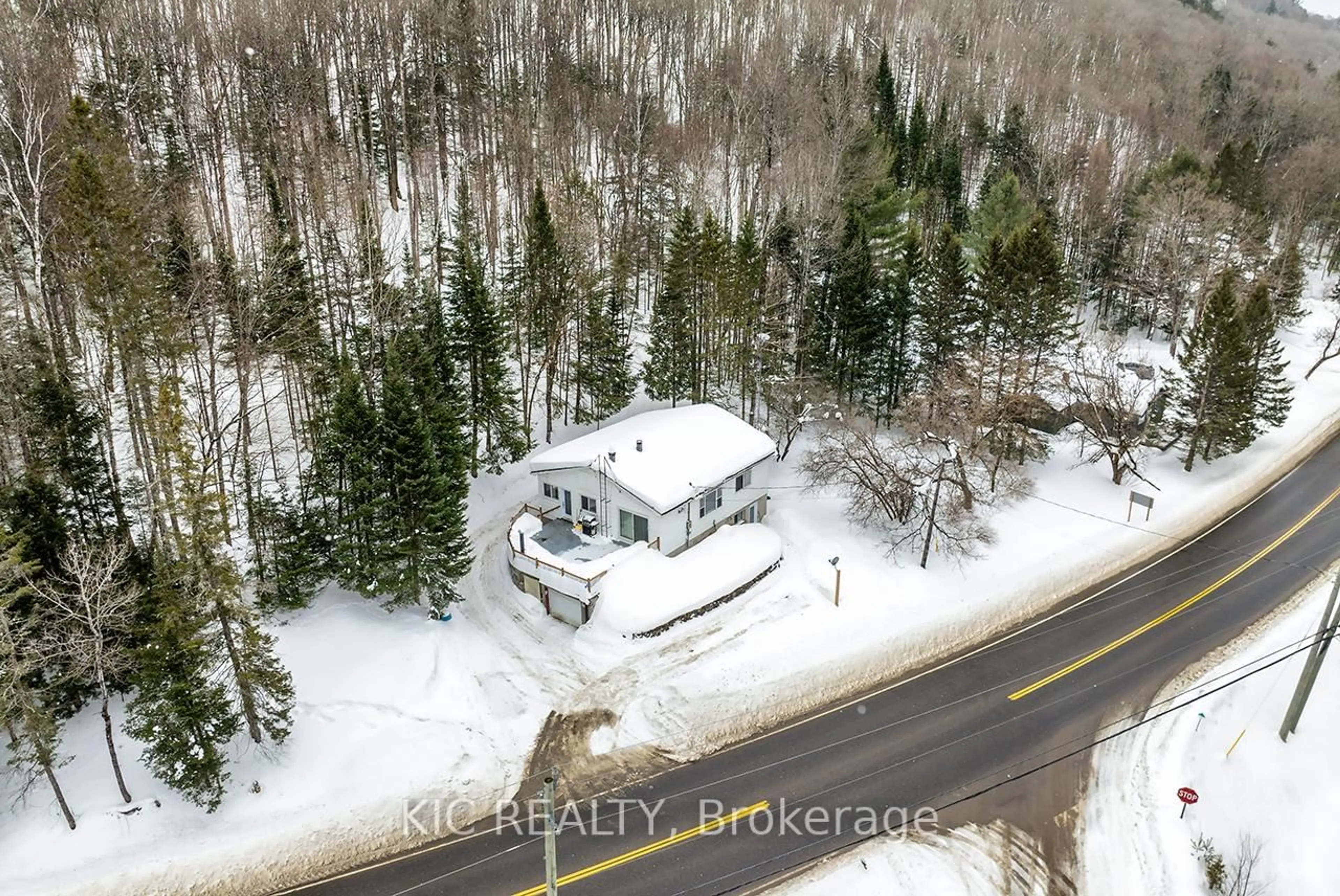 A pic from outside/outdoor area/front of a property/back of a property/a pic from drone, street for 14202 Highway 118 Highway, Dysart et al Ontario K0M 1S0