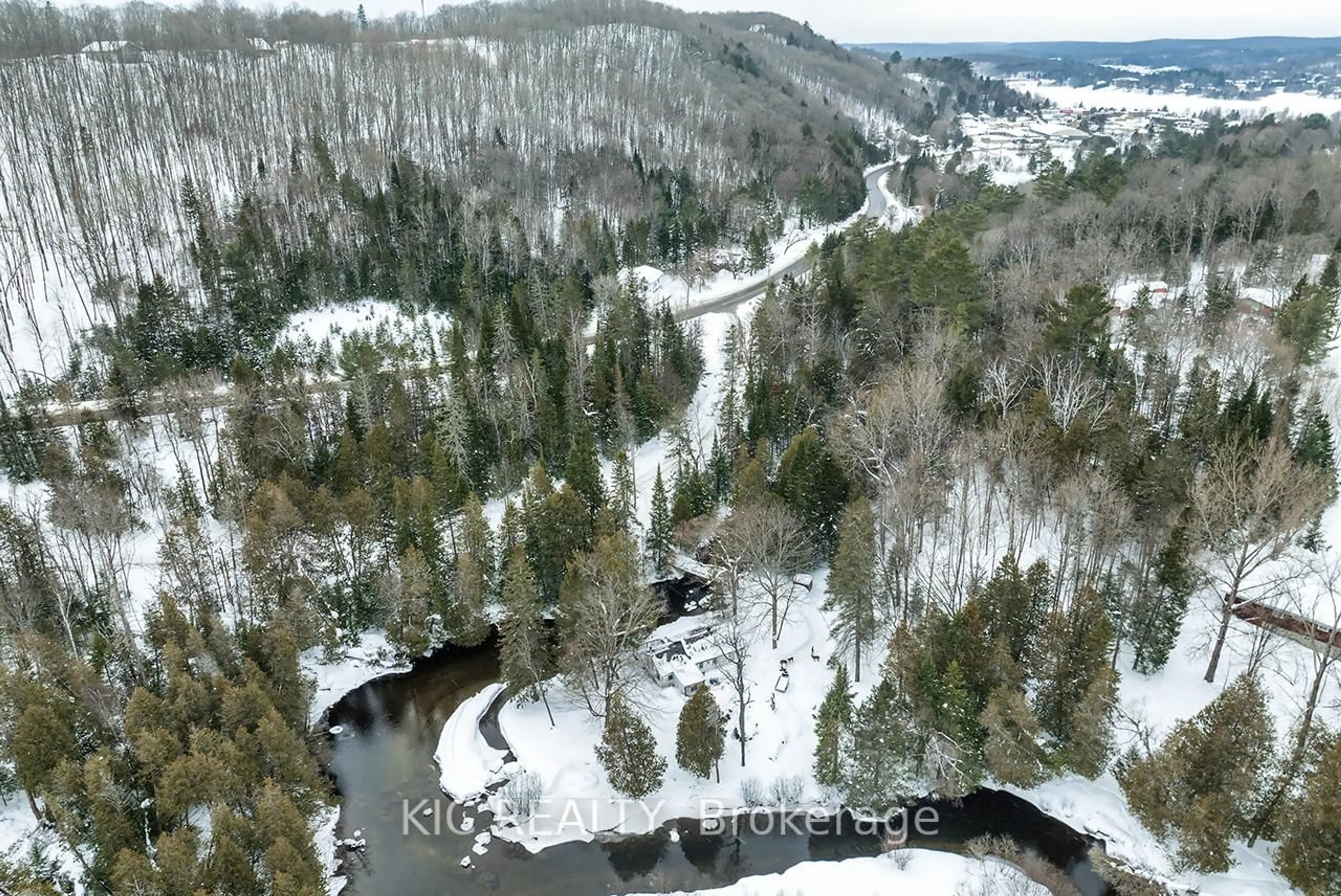 A pic from outside/outdoor area/front of a property/back of a property/a pic from drone, forest/trees view for 14202 Highway 118 Highway, Dysart et al Ontario K0M 1S0