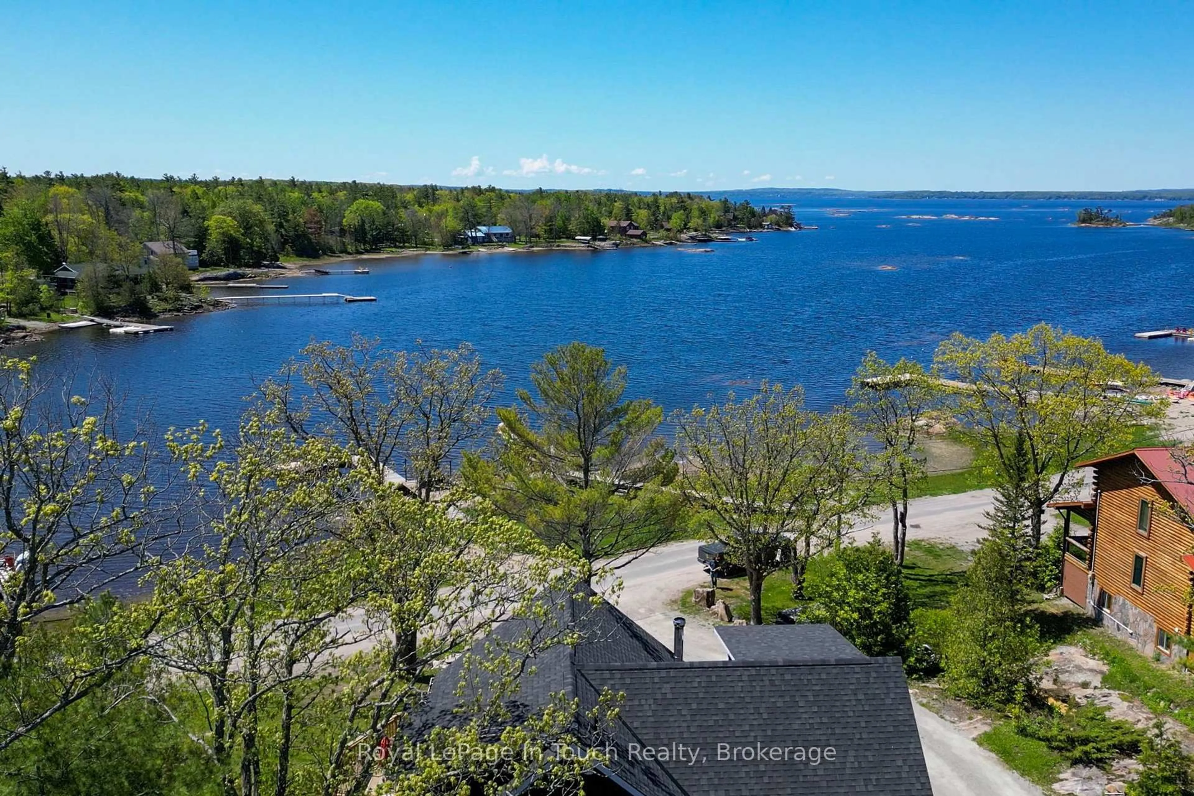 A pic from outside/outdoor area/front of a property/back of a property/a pic from drone, water/lake/river/ocean view for 26 Macey Bay Rd, Georgian Bay Ontario L0K 1S0