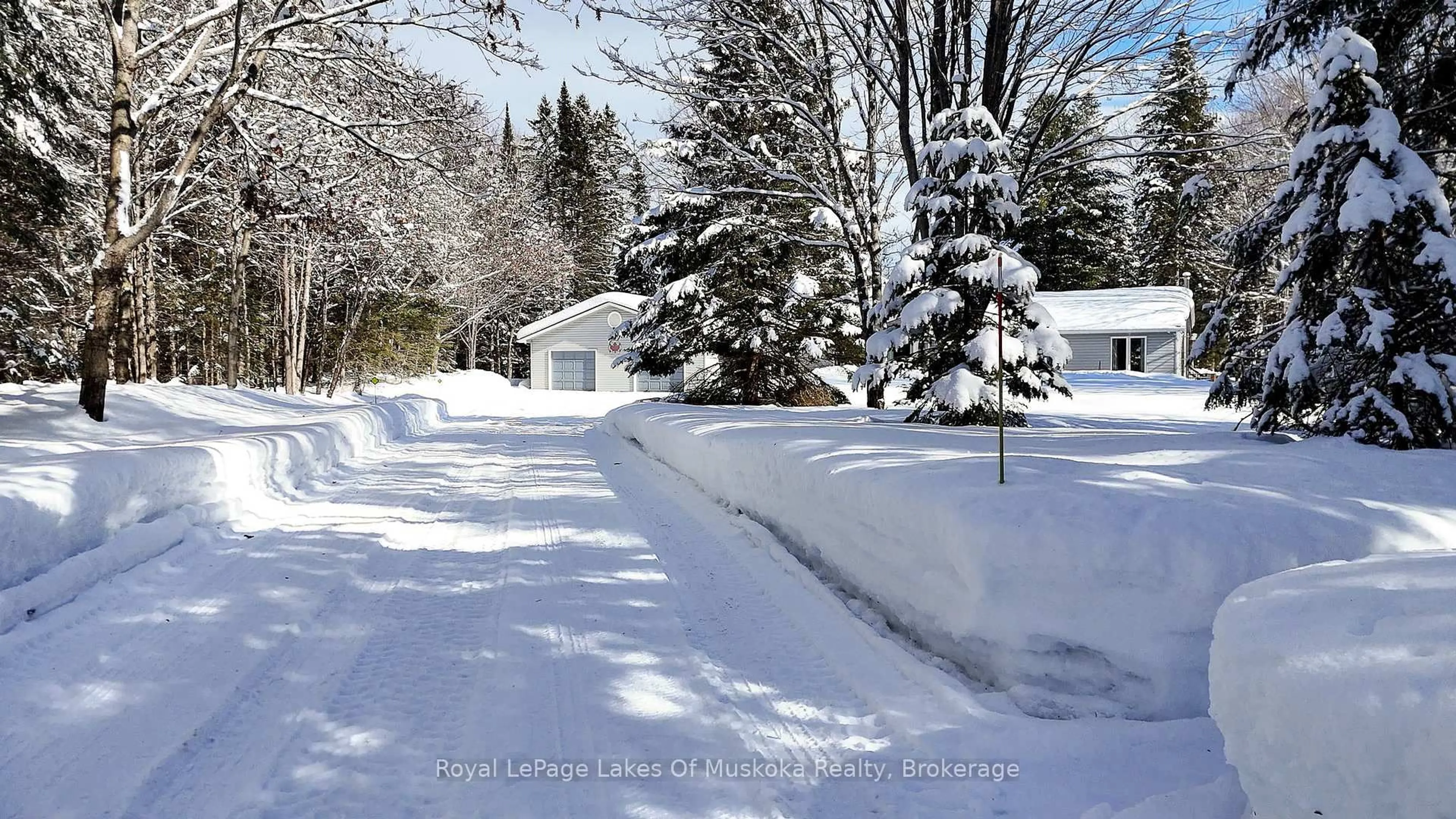 A pic from outside/outdoor area/front of a property/back of a property/a pic from drone, street for 57 Hiawatha Dr, Huntsville Ontario P0B 1L0