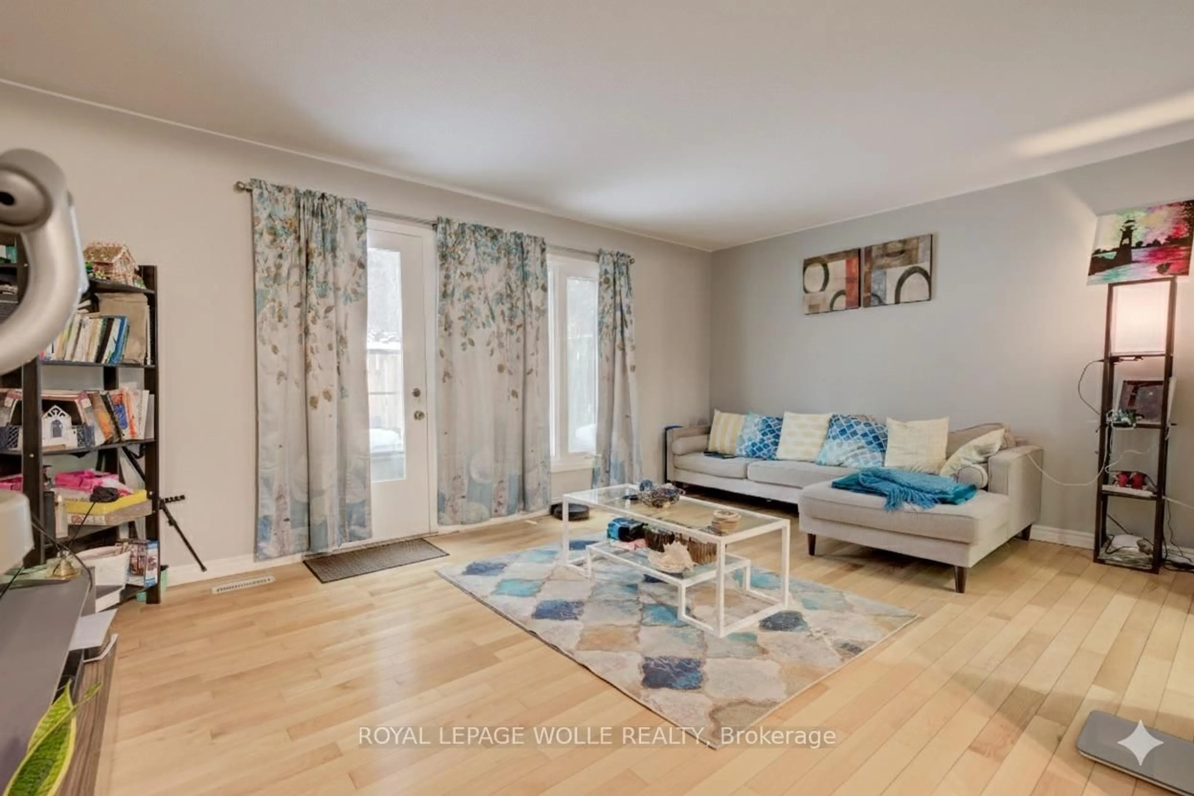 Living room with furniture, wood/laminate floor for 206 Green Valley Dr #30, Kitchener Ontario N2P 1G9