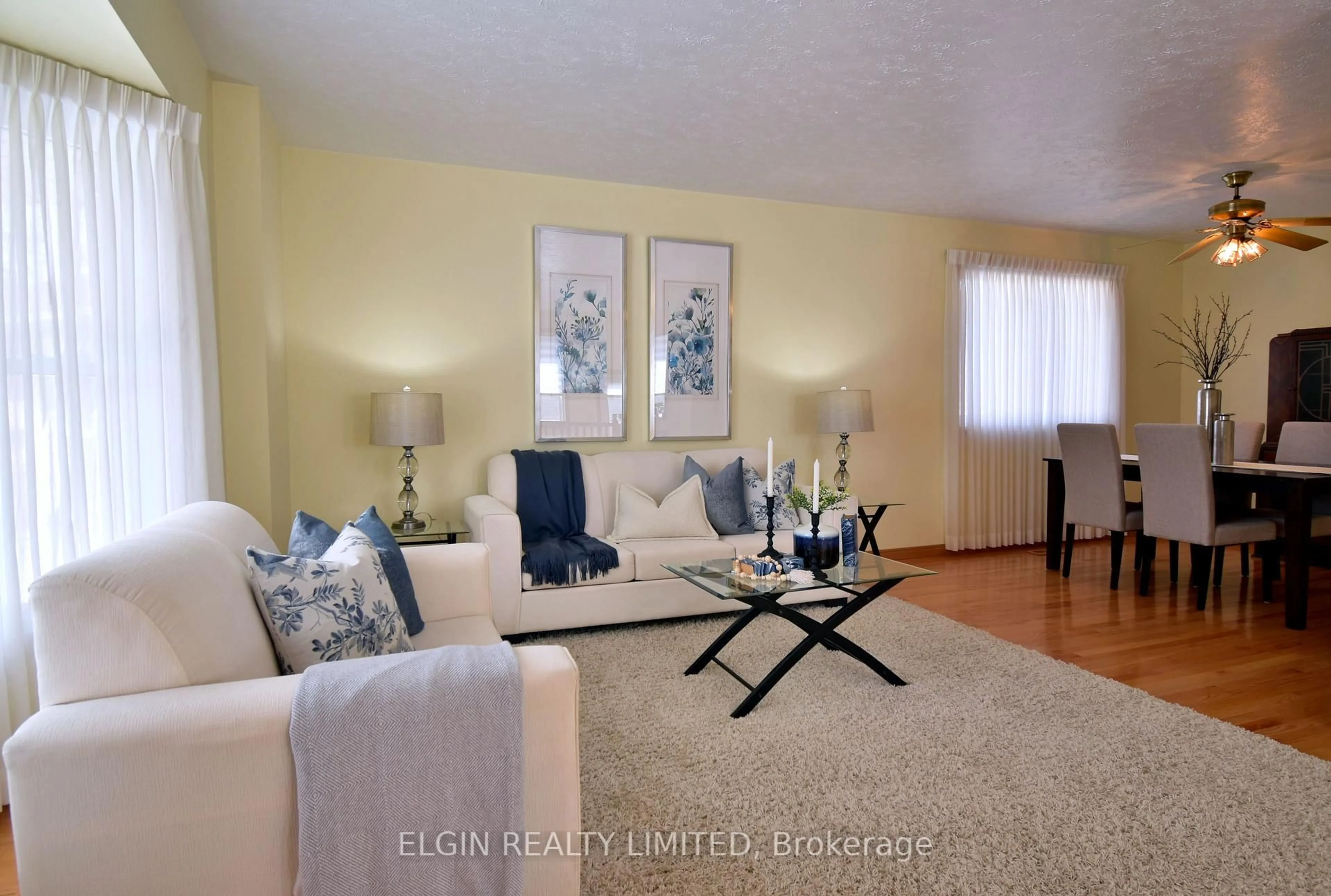 Living room with furniture, wood/laminate floor for 10 Palmer Crt, St. Thomas Ontario N5R 5Y9