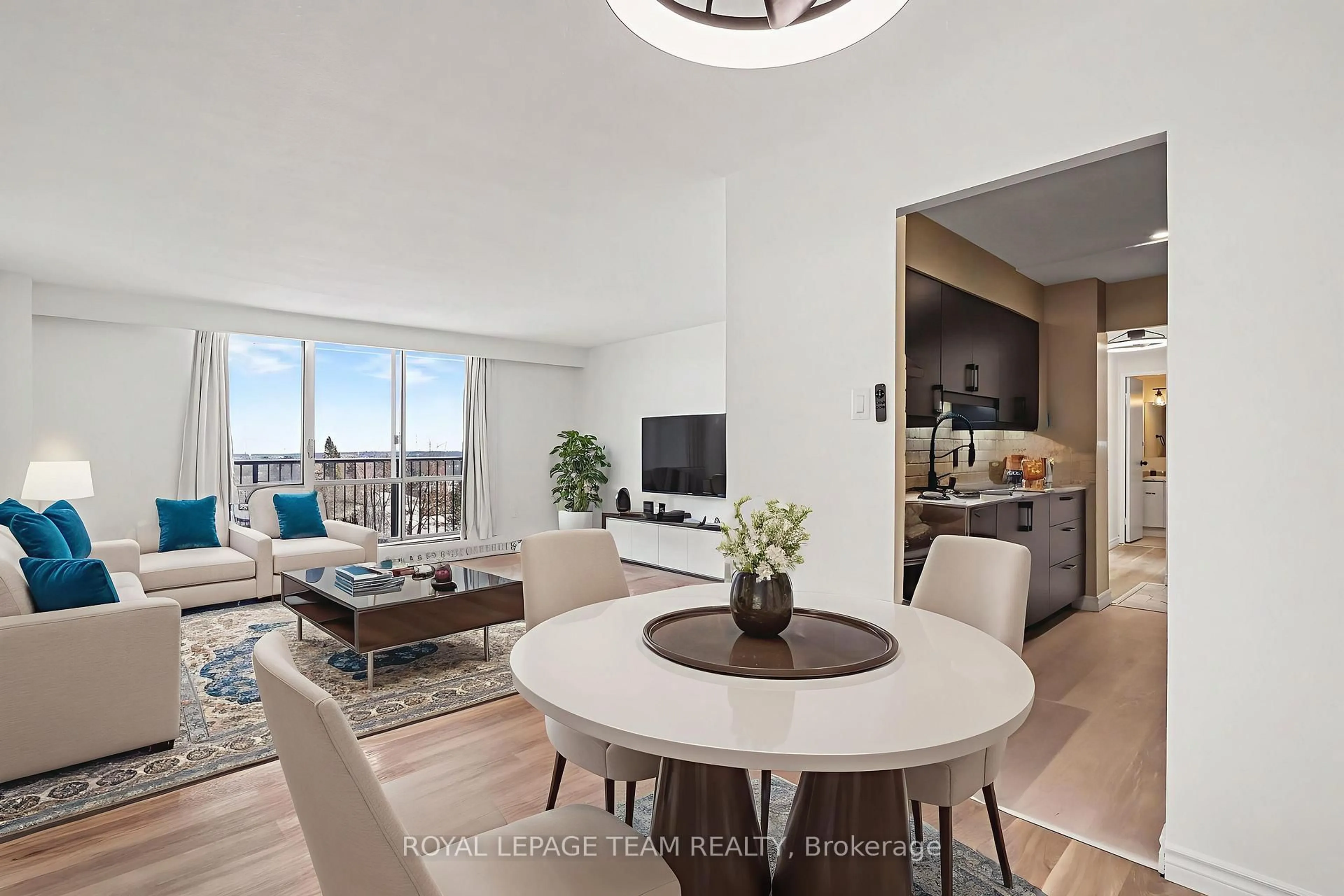 Living room with furniture, wood/laminate floor for 2400 Virginia Dr #606, Ottawa Ontario K1H 8L3