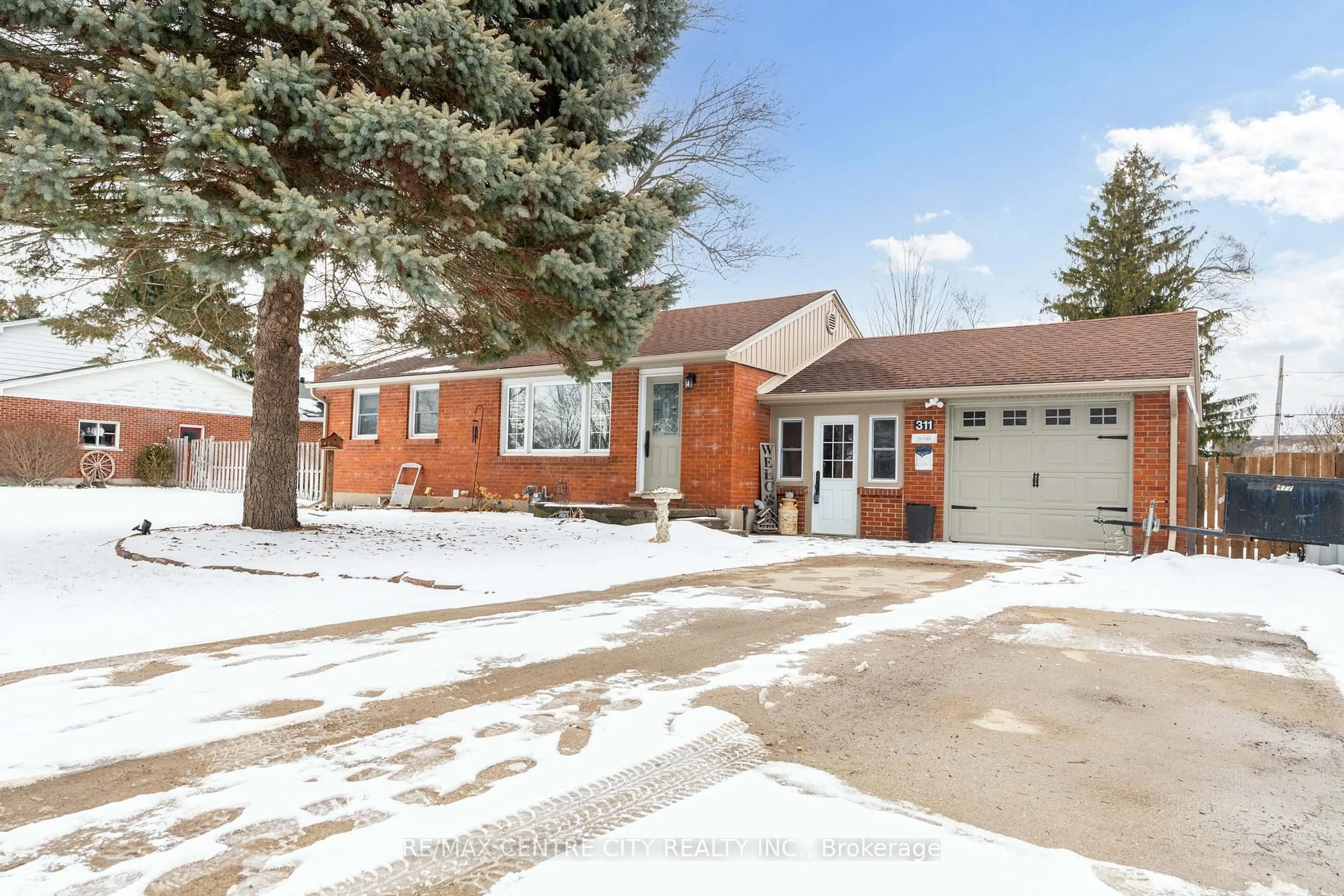 Home with brick exterior material, street for 311 Adelaide St, Strathroy-Caradoc Ontario N7G 2V9