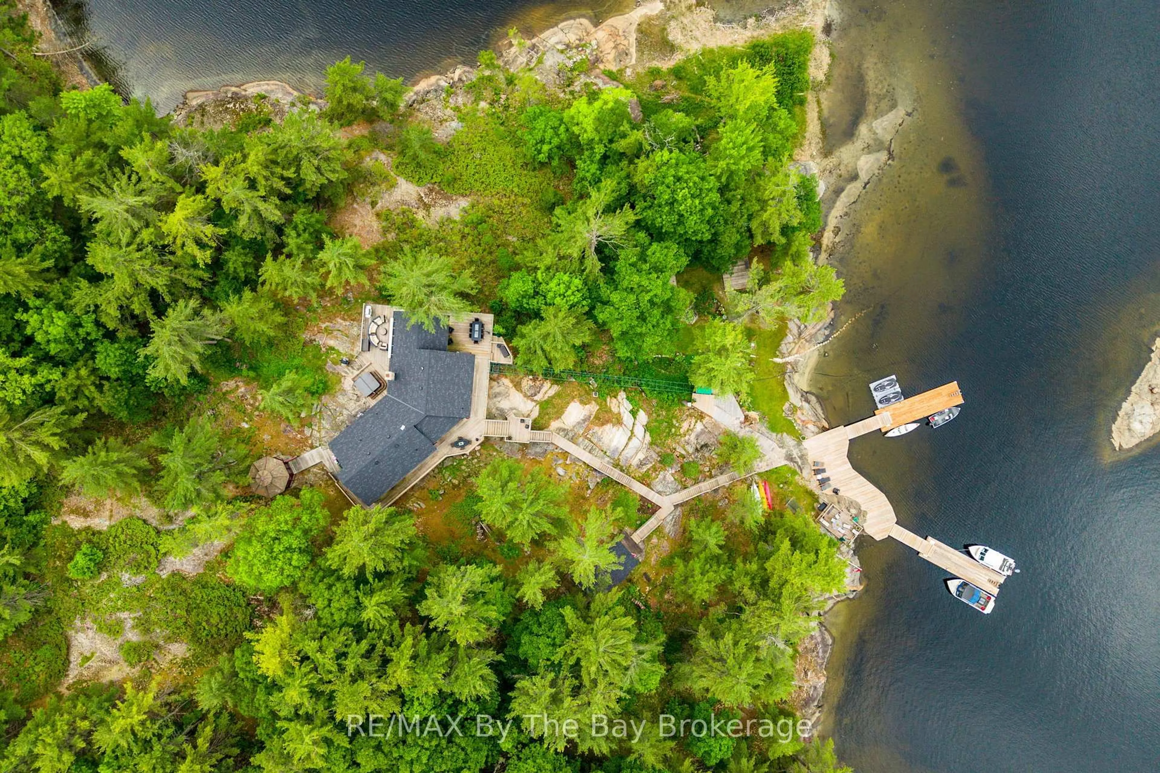 A pic from outside/outdoor area/front of a property/back of a property/a pic from drone, water/lake/river/ocean view for 3688 Is 1810, Bone Is, Georgian Bay Ontario P0E 1E0