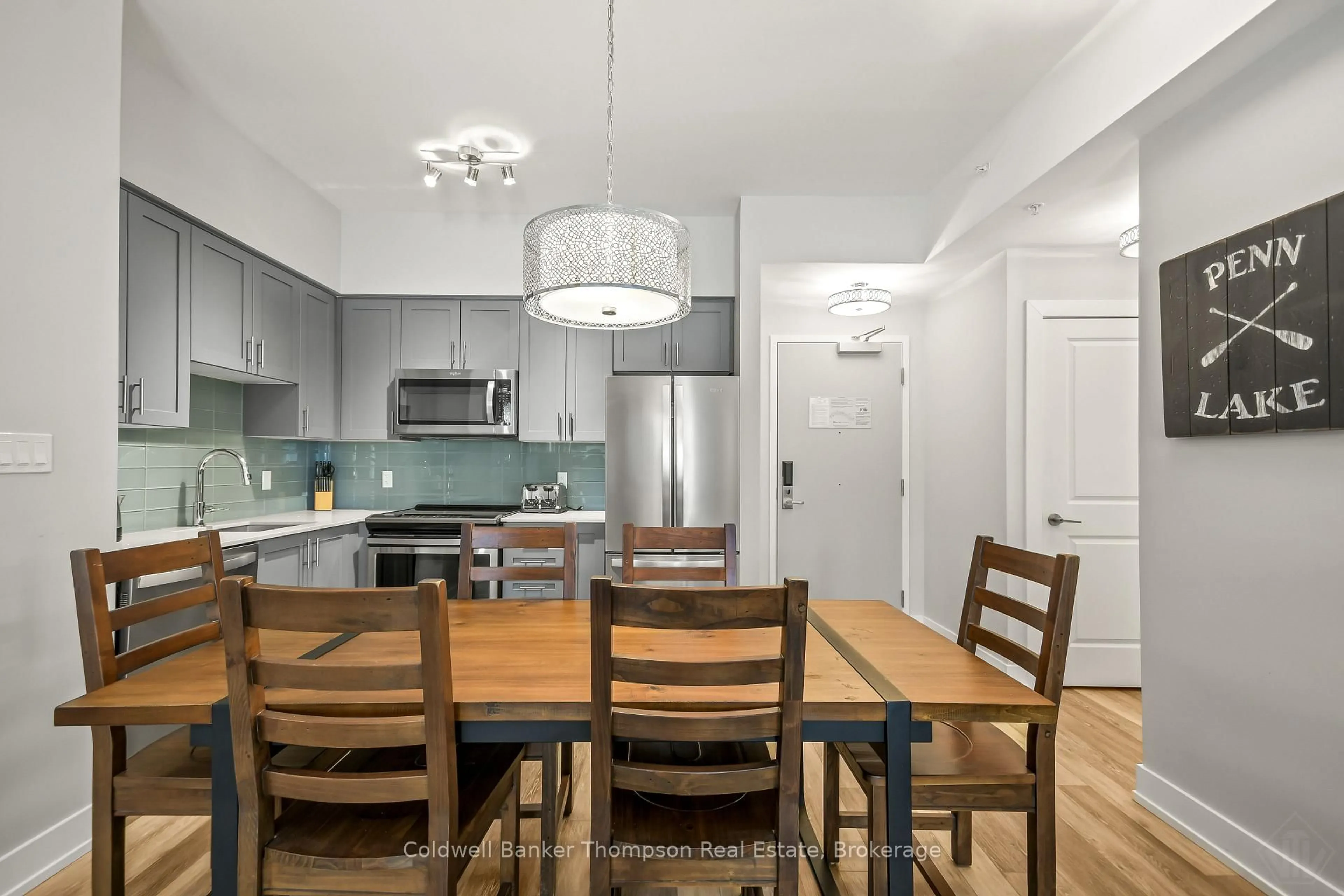 Open concept kitchen, wood/laminate floor for 25 PEN LAKE POINT Rd #403, Huntsville Ontario P1H 1A9