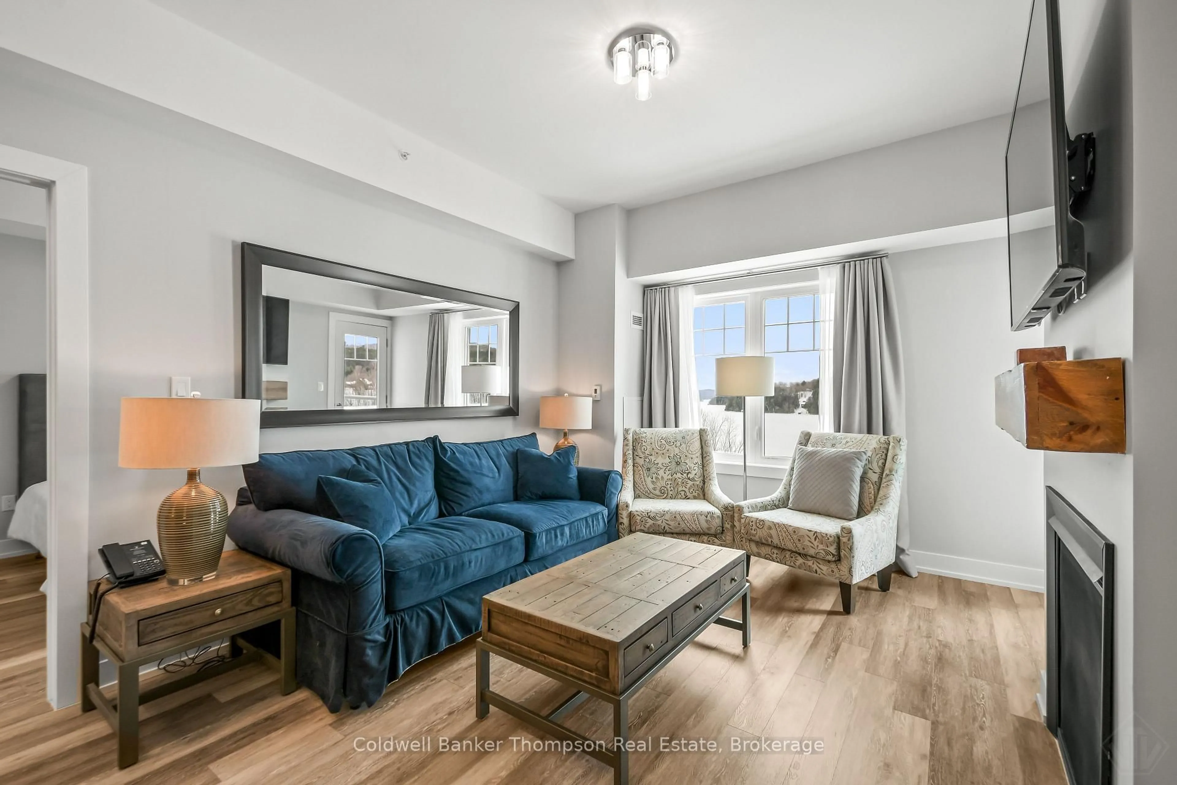 Living room with furniture, unknown for 25 PEN LAKE POINT Rd #403, Huntsville Ontario P1H 1A9