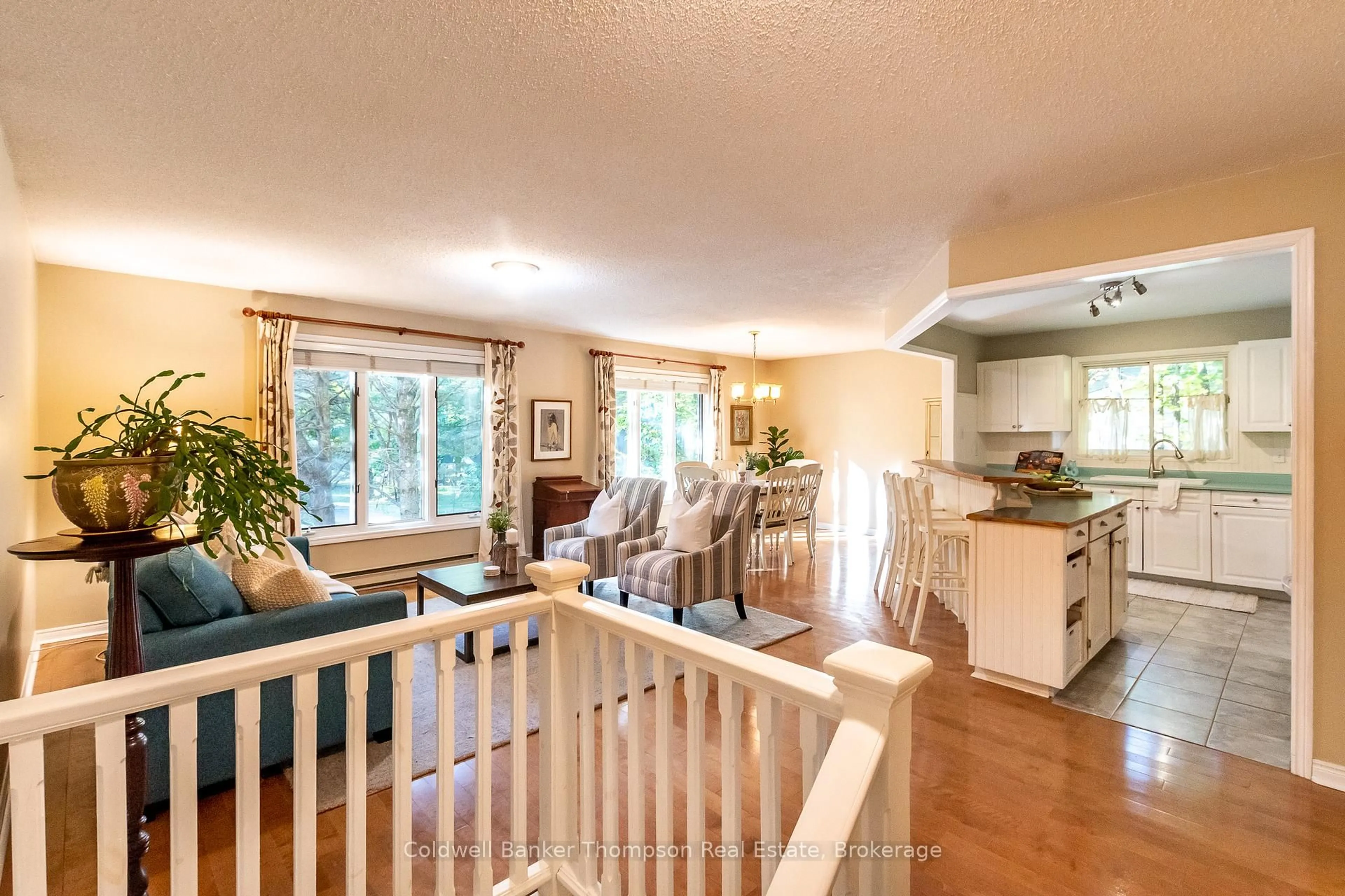 Open concept kitchen, wood/laminate floor for 22 Jenner Crt, Huntsville Ontario P0B 1L0