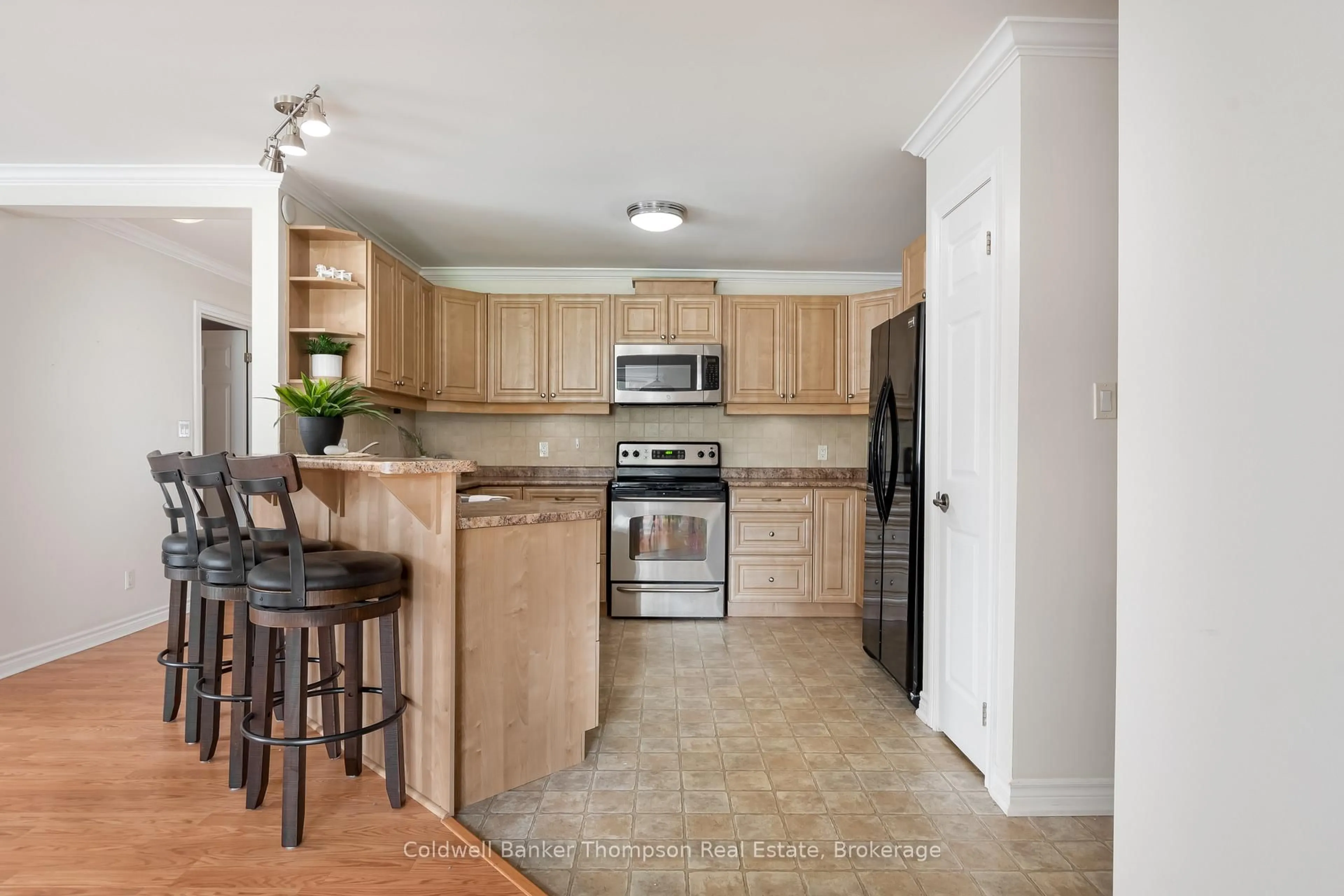 Open concept kitchen, ceramic/tile floor for 24 Dairy Lane #101, Huntsville Ontario P1H 0A4