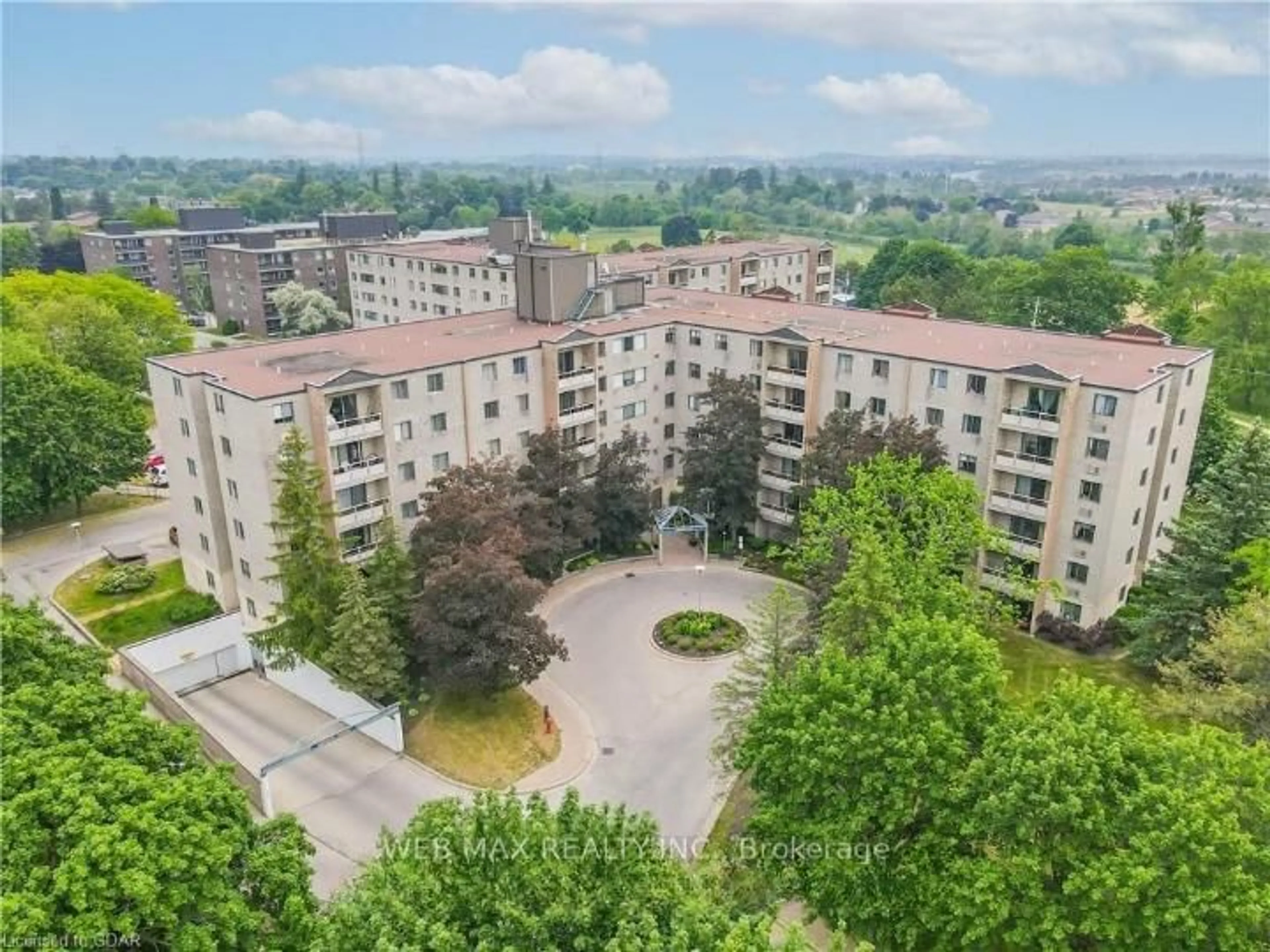 A pic from outside/outdoor area/front of a property/back of a property/a pic from drone, unknown for 93 Westwood Rd #311, Guelph Ontario N1H 7J7