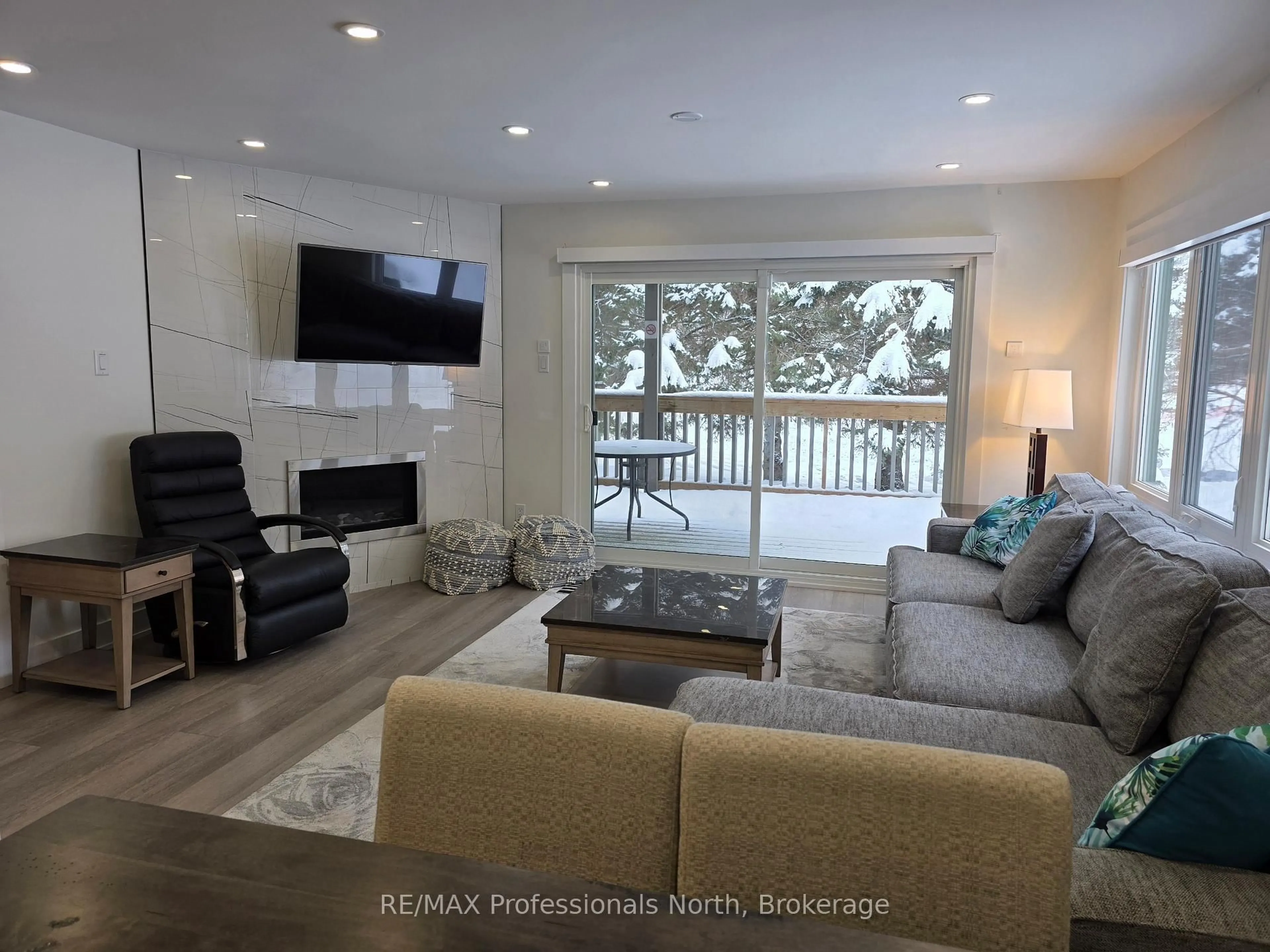 Living room with furniture, unknown for 32 Deerhurst Greens Dr #105, Huntsville Ontario P1H 2E8