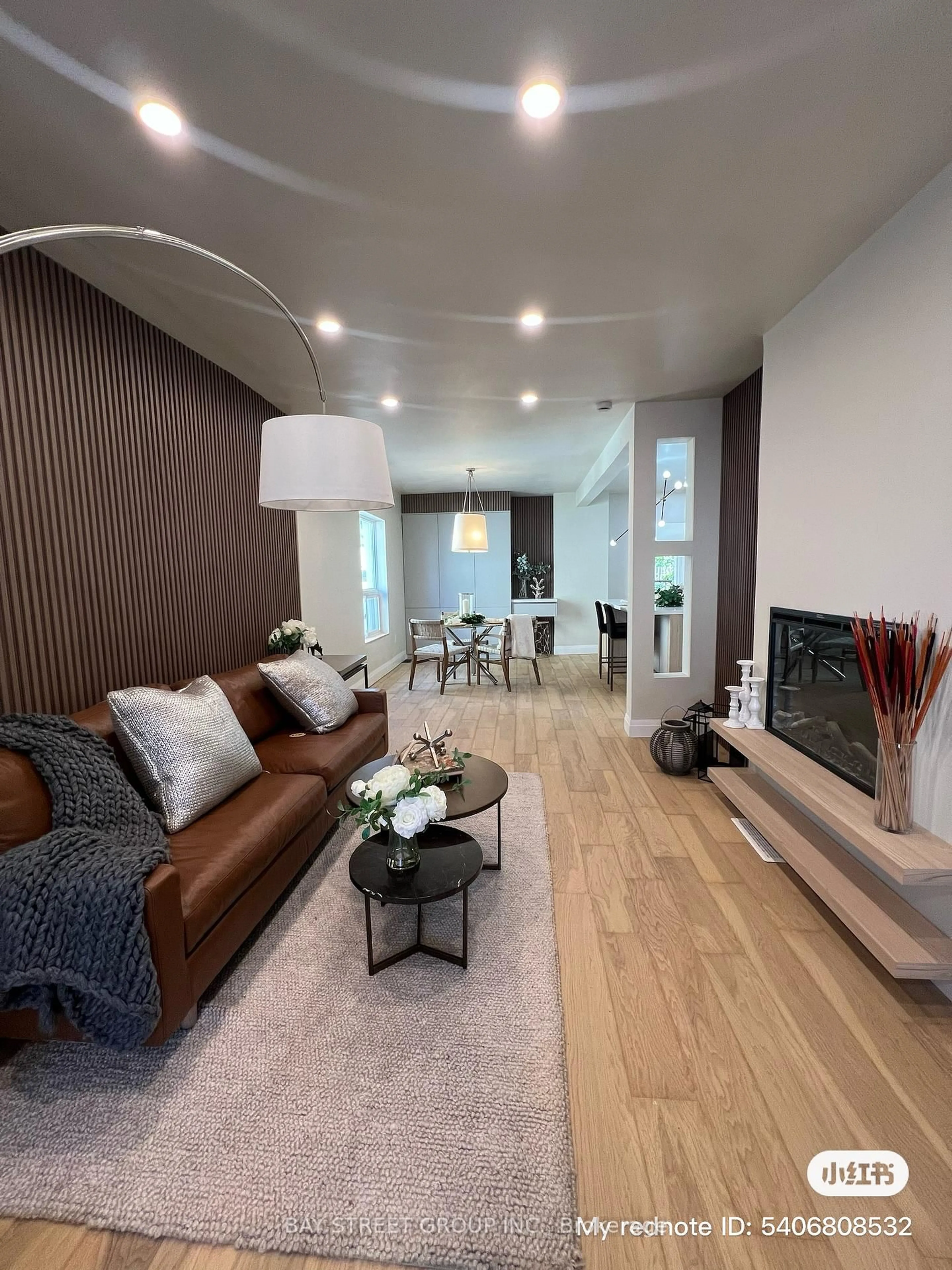 Living room with furniture, wood/laminate floor for 396 Emerald St, Hamilton Ontario L8L 5L9