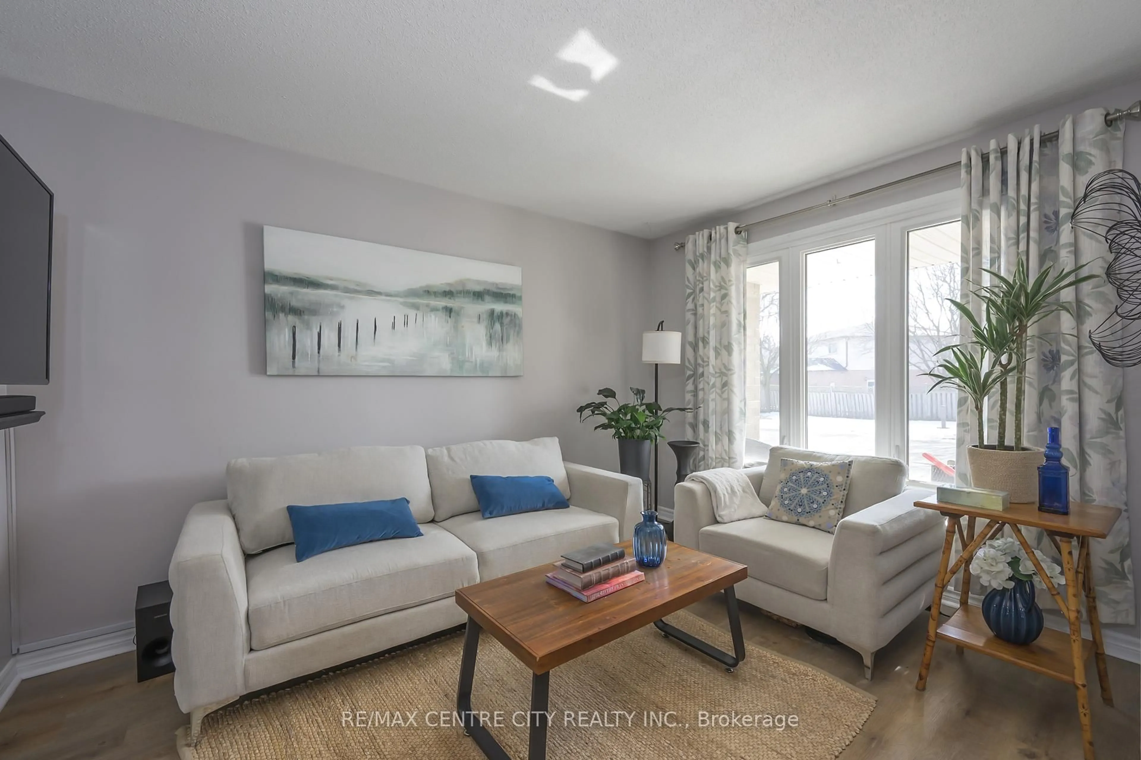Living room with furniture, wood/laminate floor for 245 Martinet Ave, London East Ontario N5V 4B2