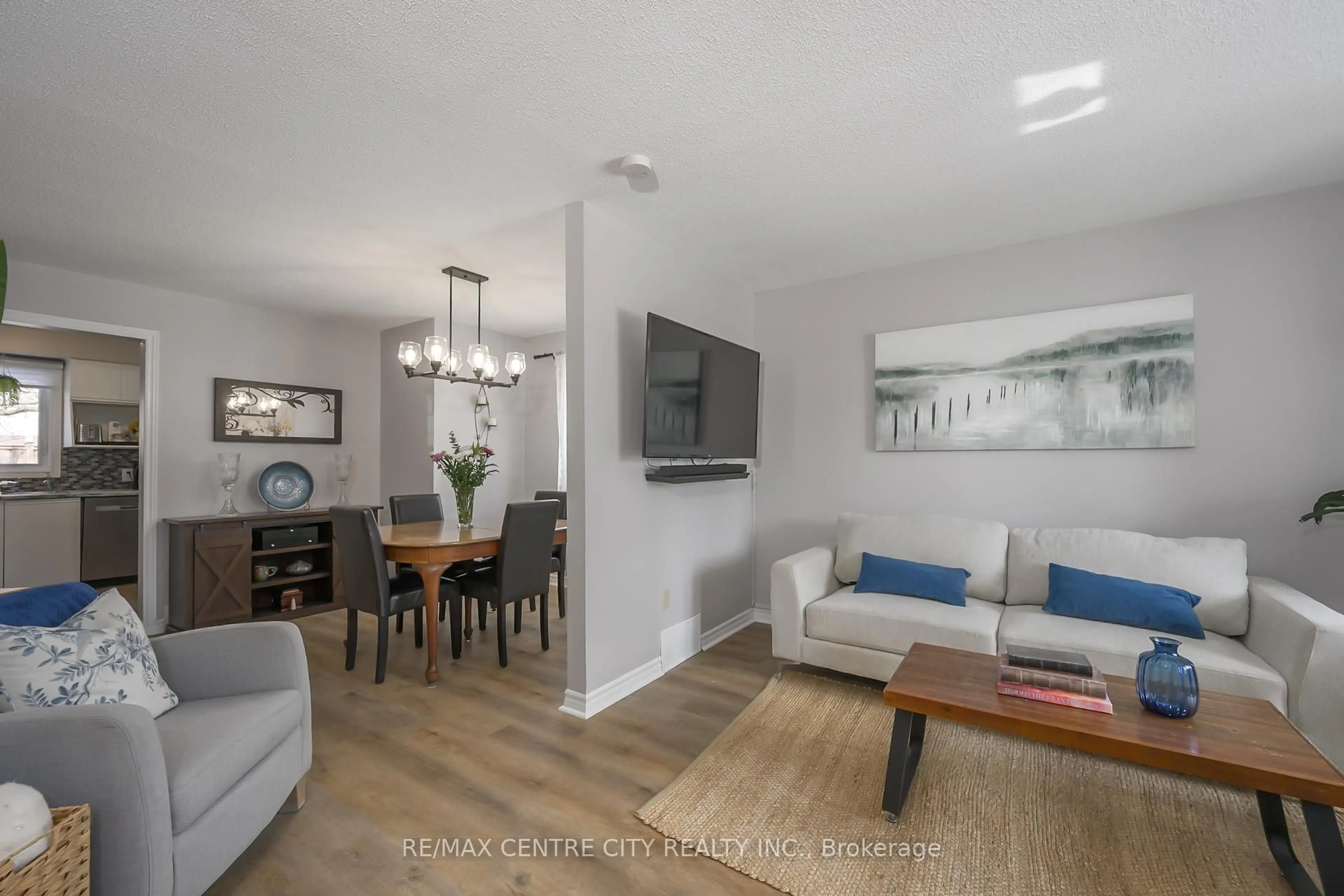 Living room with furniture, wood/laminate floor for 245 Martinet Ave, London East Ontario N5V 4B2