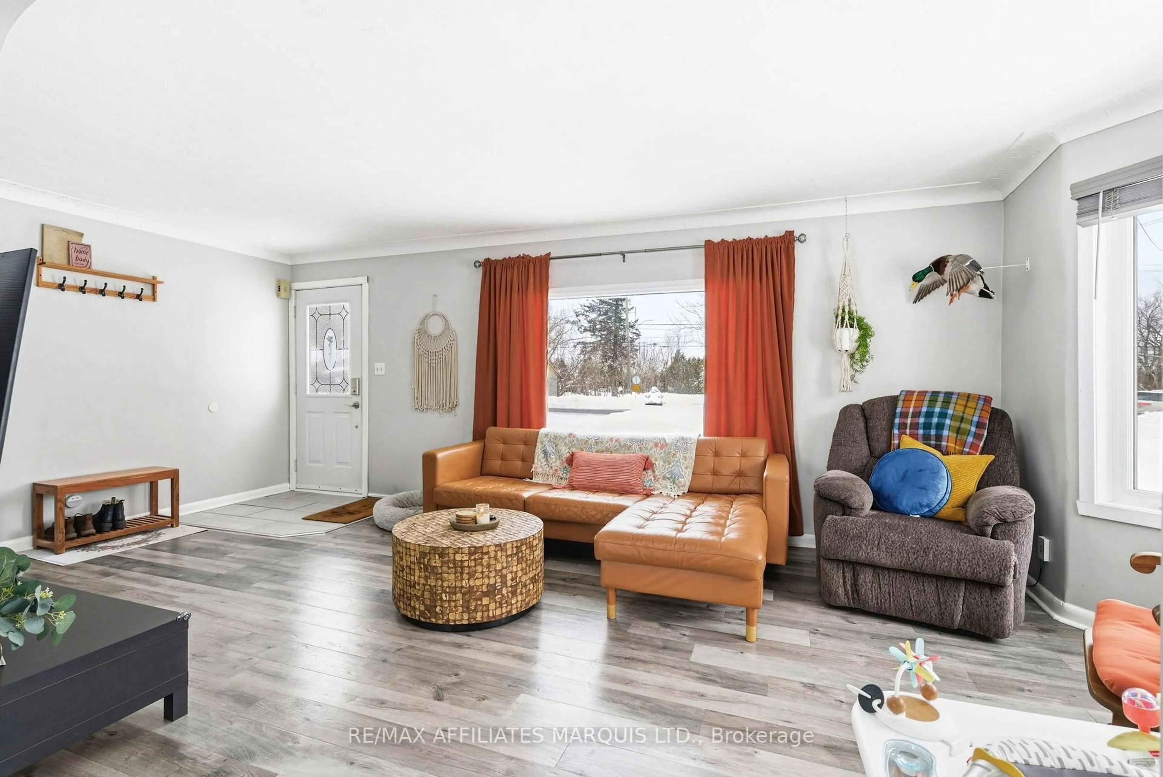 Living room with furniture, wood/laminate floor for 17224 County Rd 18 Rd, South Stormont Ontario K0C 1P0