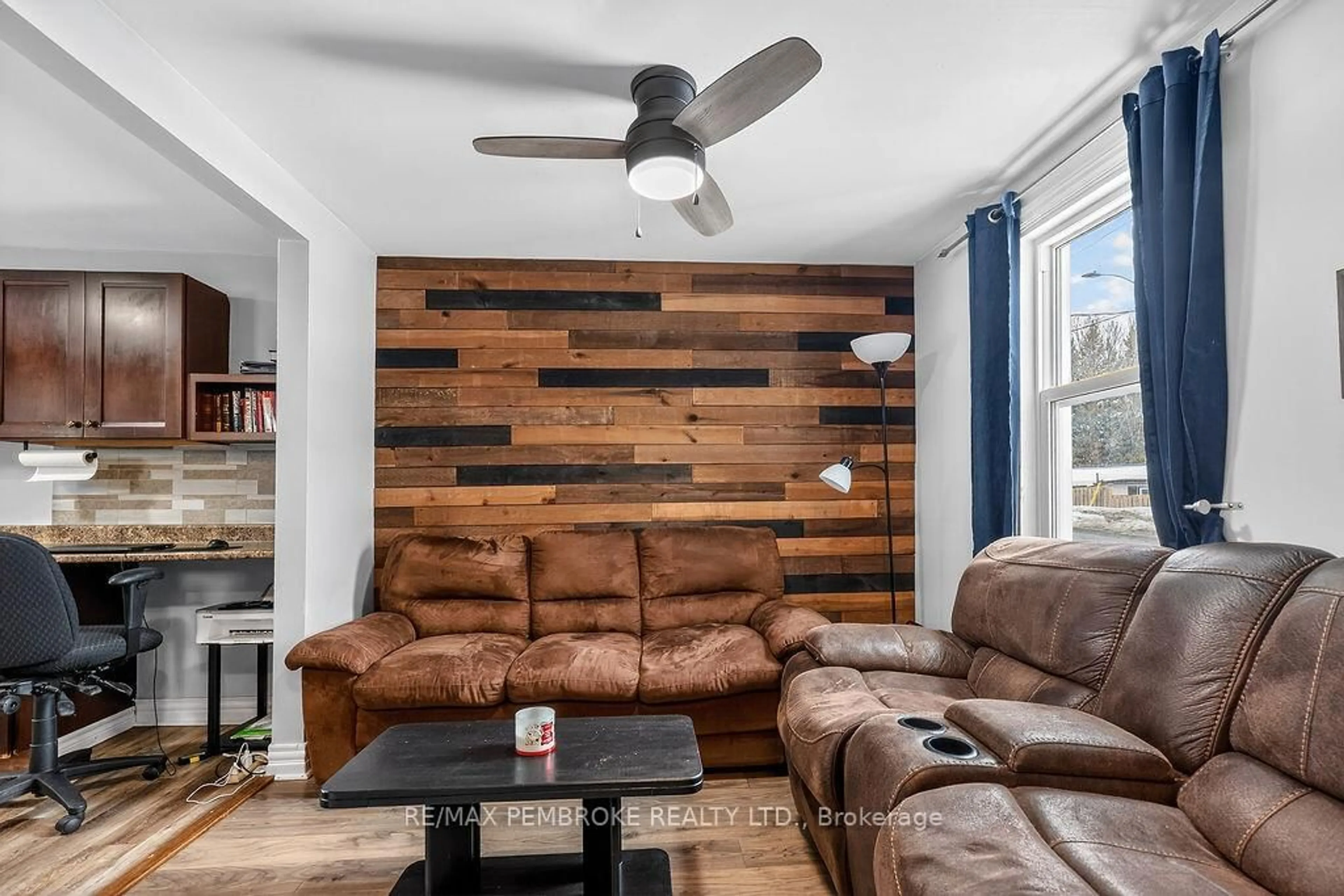 Living room with furniture, wood/laminate floor for 241 Forced Rd, Pembroke Ontario K8A 5J3