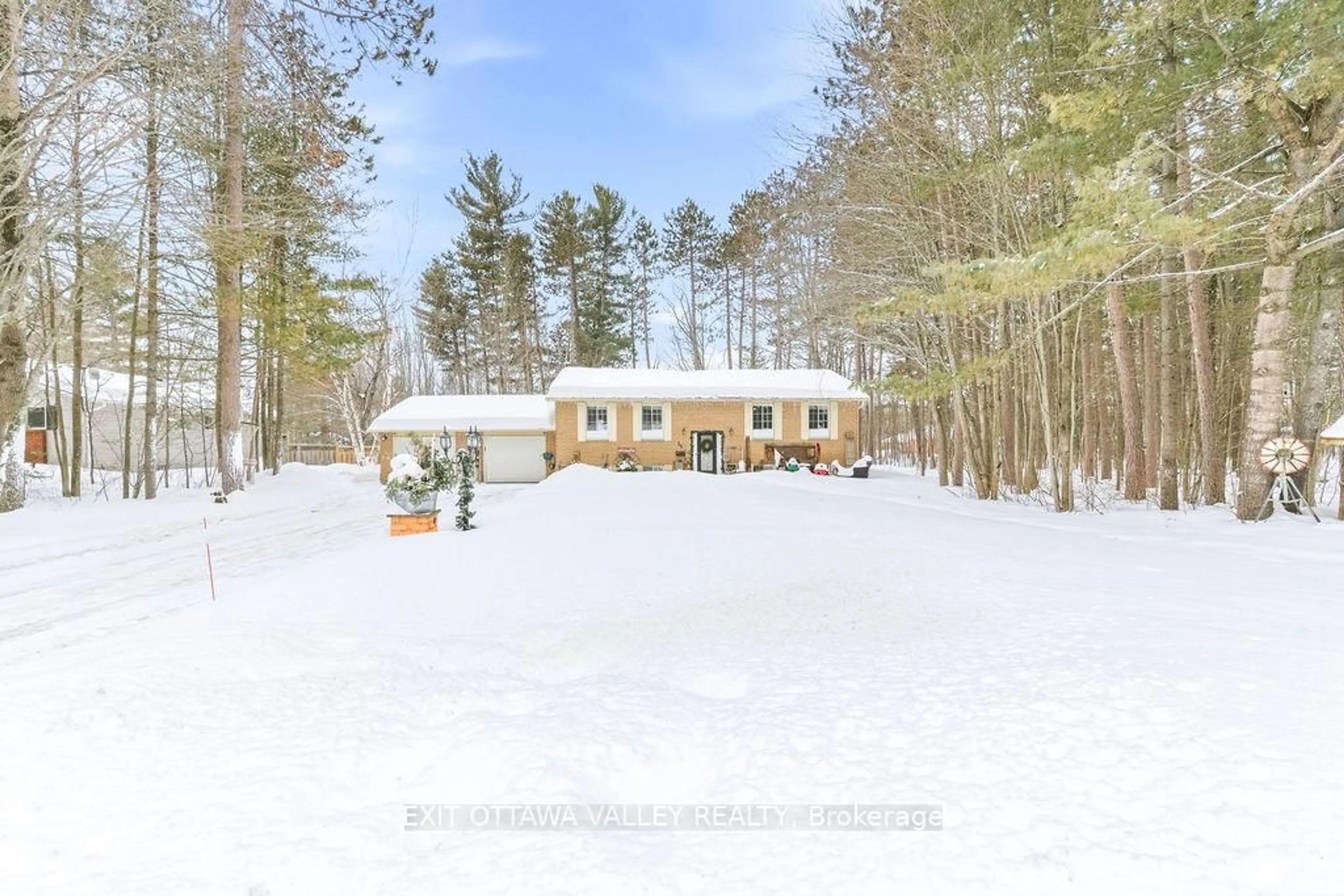 A pic from outside/outdoor area/front of a property/back of a property/a pic from drone, forest/trees view for 16 Heritage Dr, Petawawa Ontario K8H 3J3