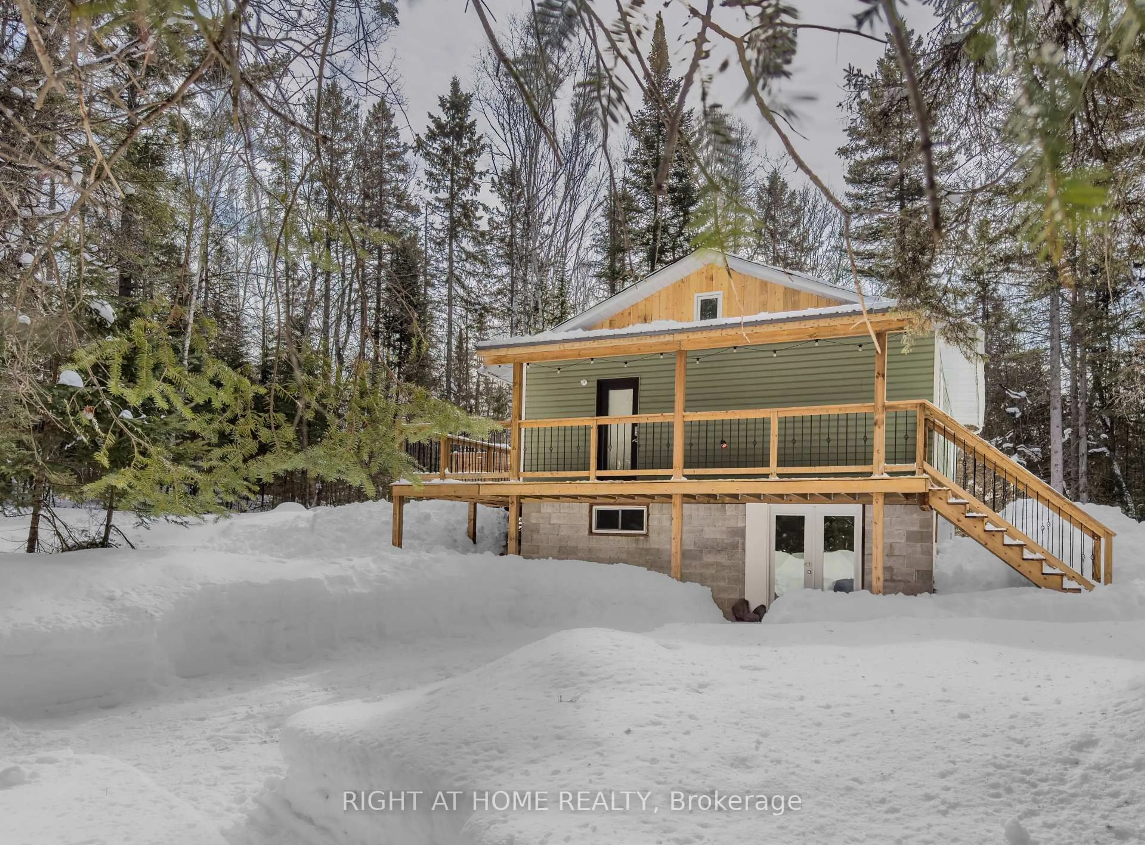 A pic from outside/outdoor area/front of a property/back of a property/a pic from drone, water/lake/river/ocean view for 1861 Glamor Lake Rd, Highlands East Ontario K0M 1R0