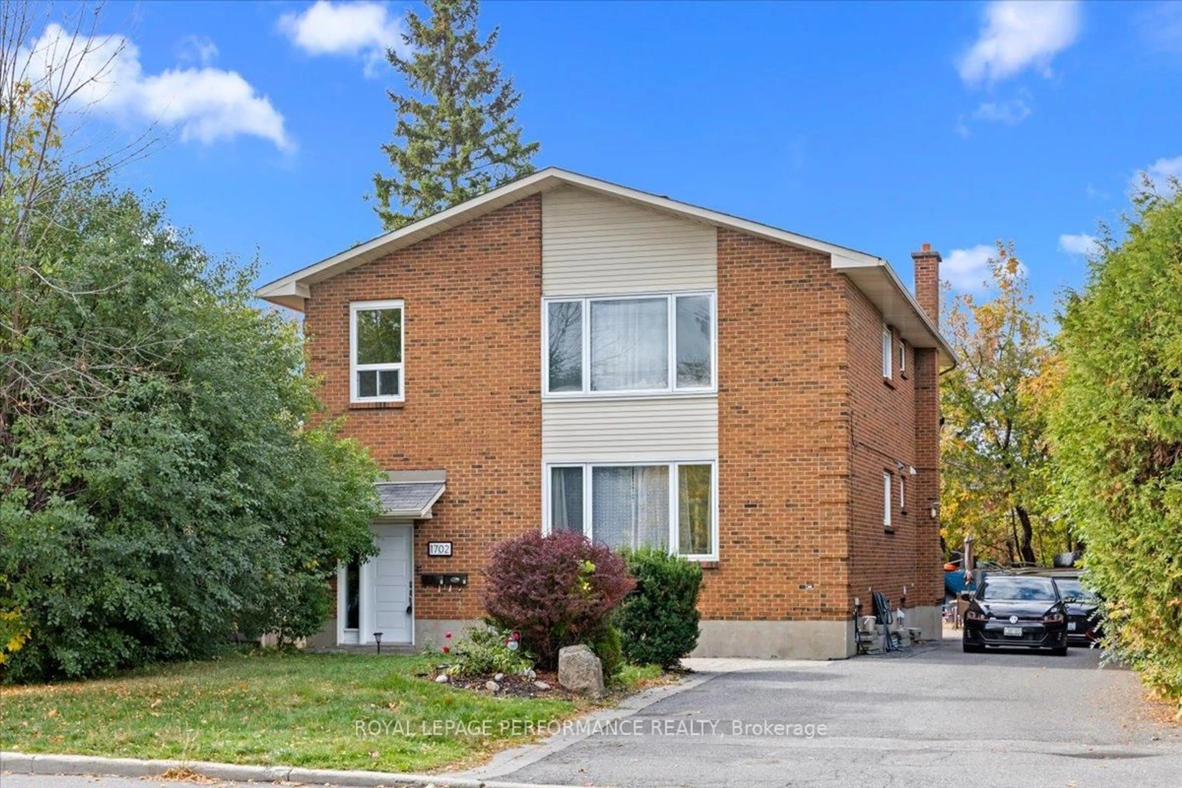 Home with brick exterior material, street for 1702 Russell Rd, Ottawa Ontario K1G 0M9