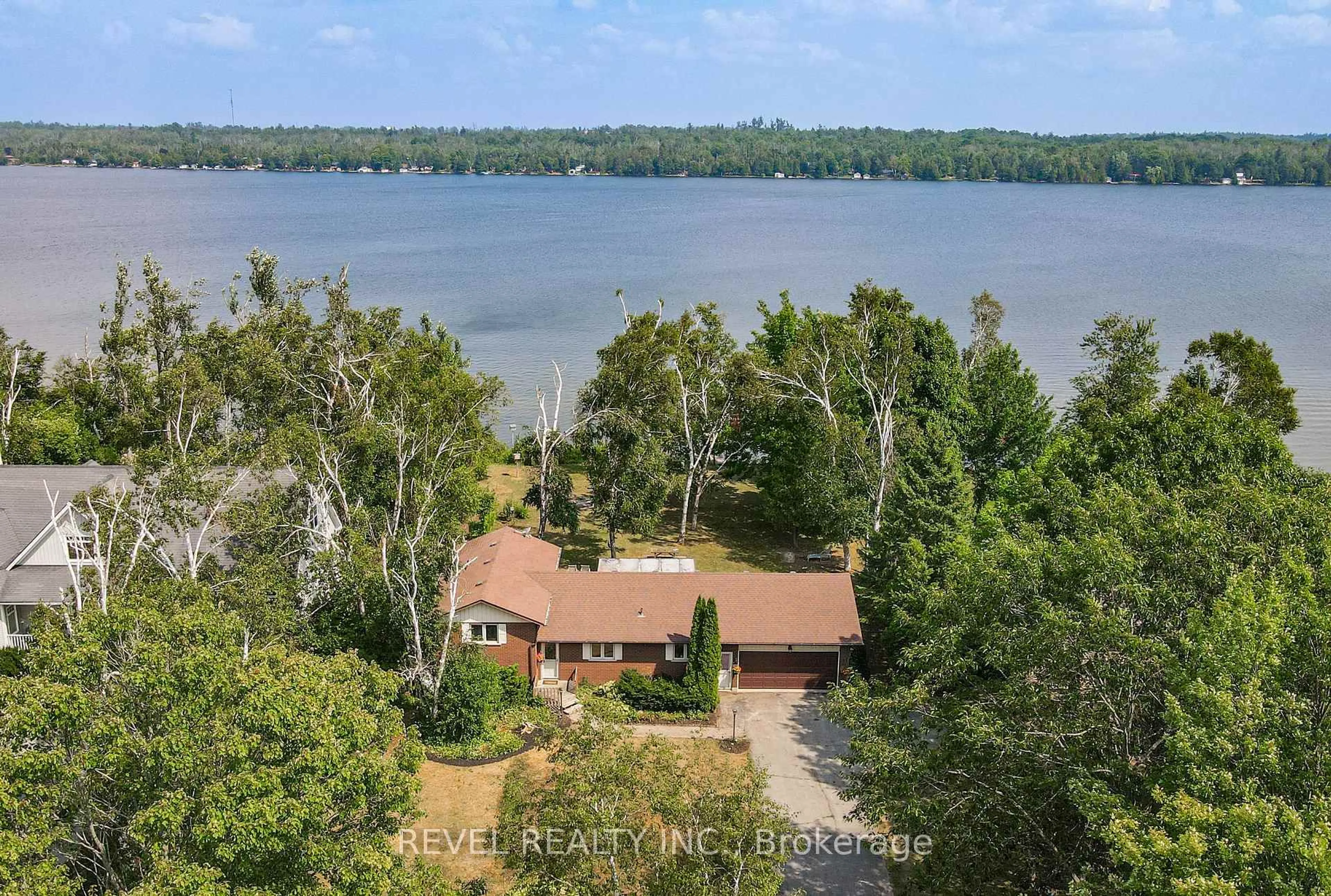 A pic from outside/outdoor area/front of a property/back of a property/a pic from drone, water/lake/river/ocean view for 126 Pinewood Blvd, Kawartha Lakes Ontario K0M 2T0