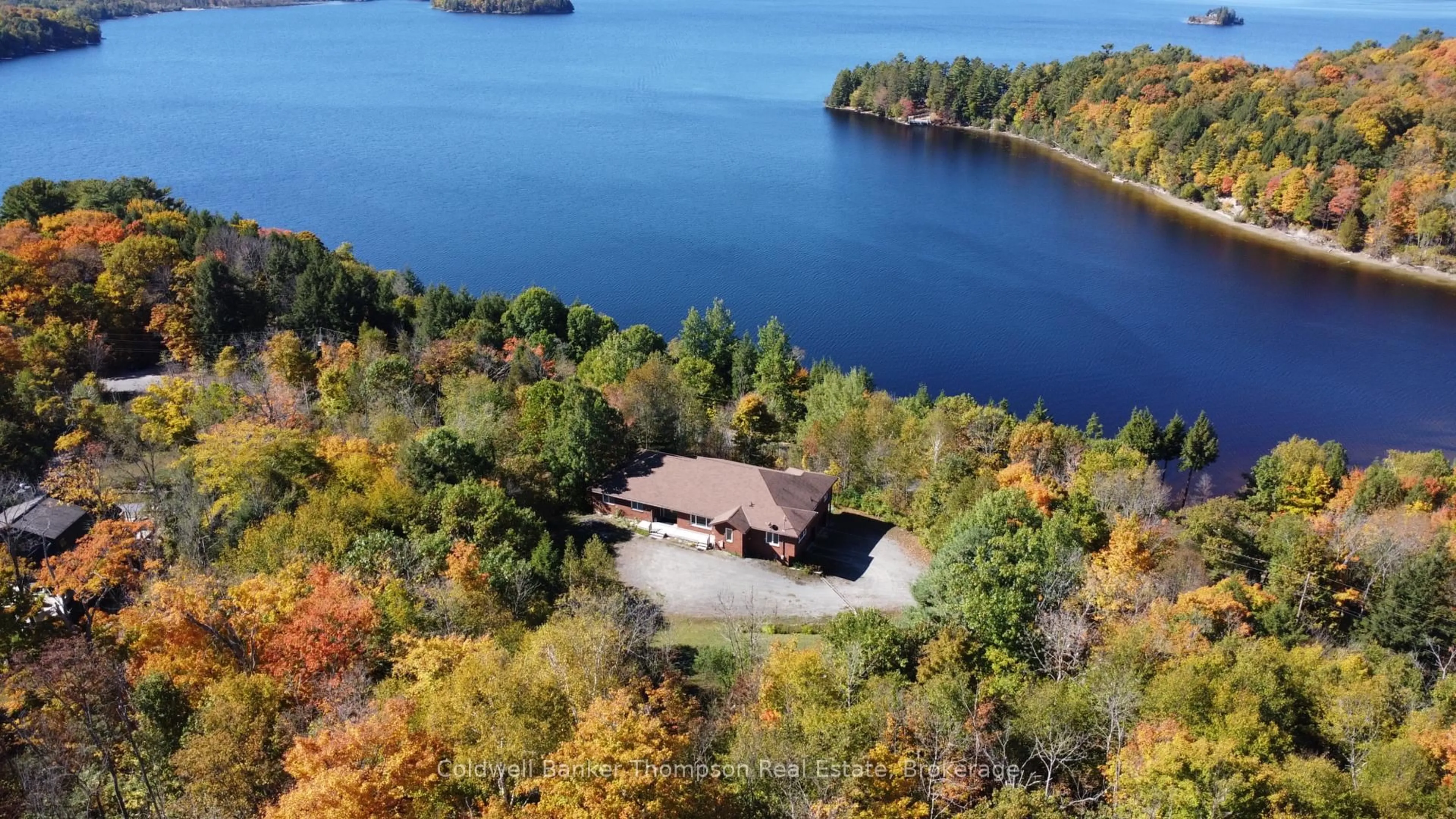 A pic from outside/outdoor area/front of a property/back of a property/a pic from drone, water/lake/river/ocean view for 625 Bayshore Blvd, Huntsville Ontario P1H 1Z1