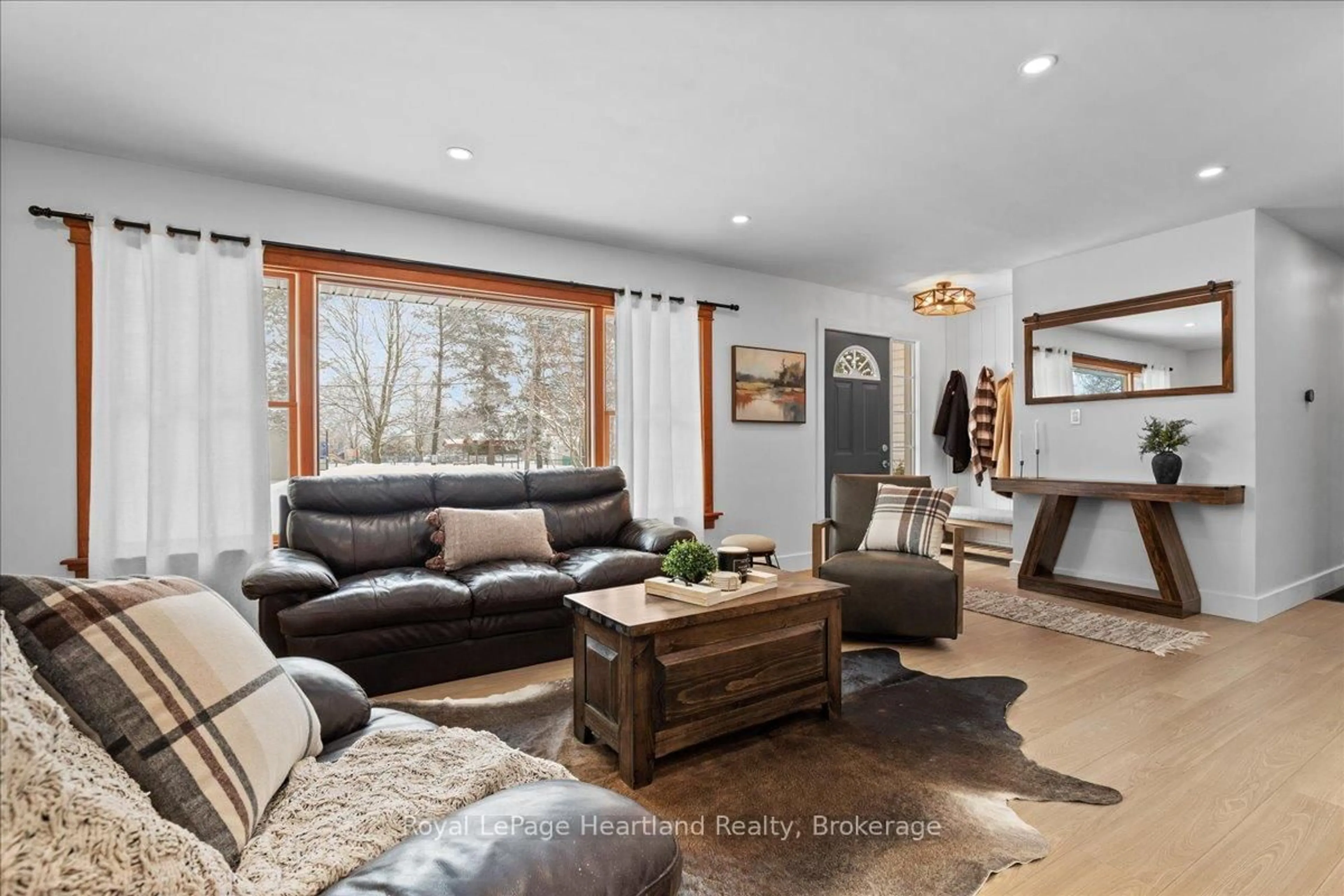 Living room with furniture, wood/laminate floor for 77 Chalk St, Huron East Ontario N0K 1W0