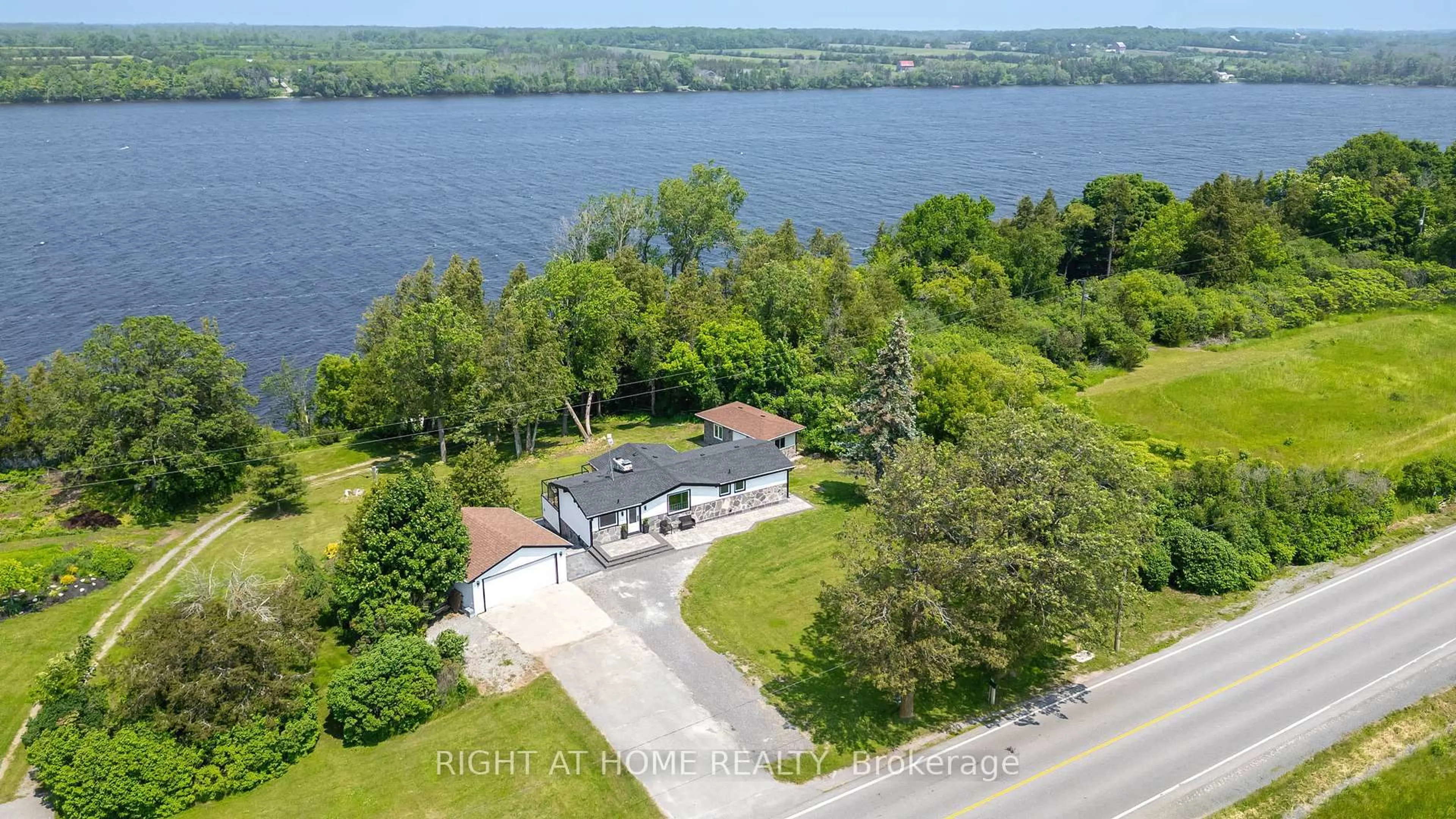 A pic from outside/outdoor area/front of a property/back of a property/a pic from drone, water/lake/river/ocean view for 4670 COUNTY ROAD 1 Rd, Prince Edward County Ontario K0K 1T0